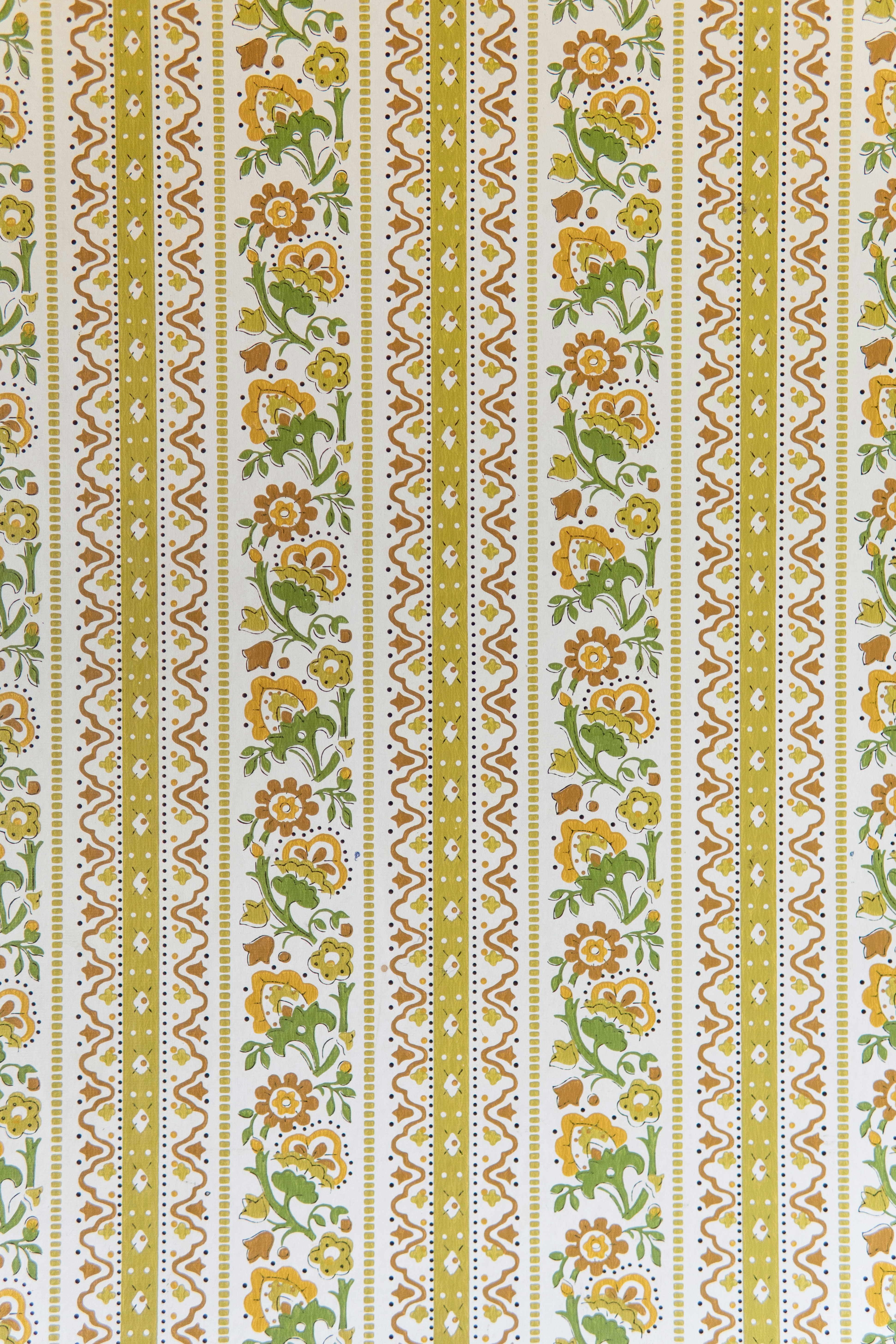 Floral striped wallpaper with green and orange patterns