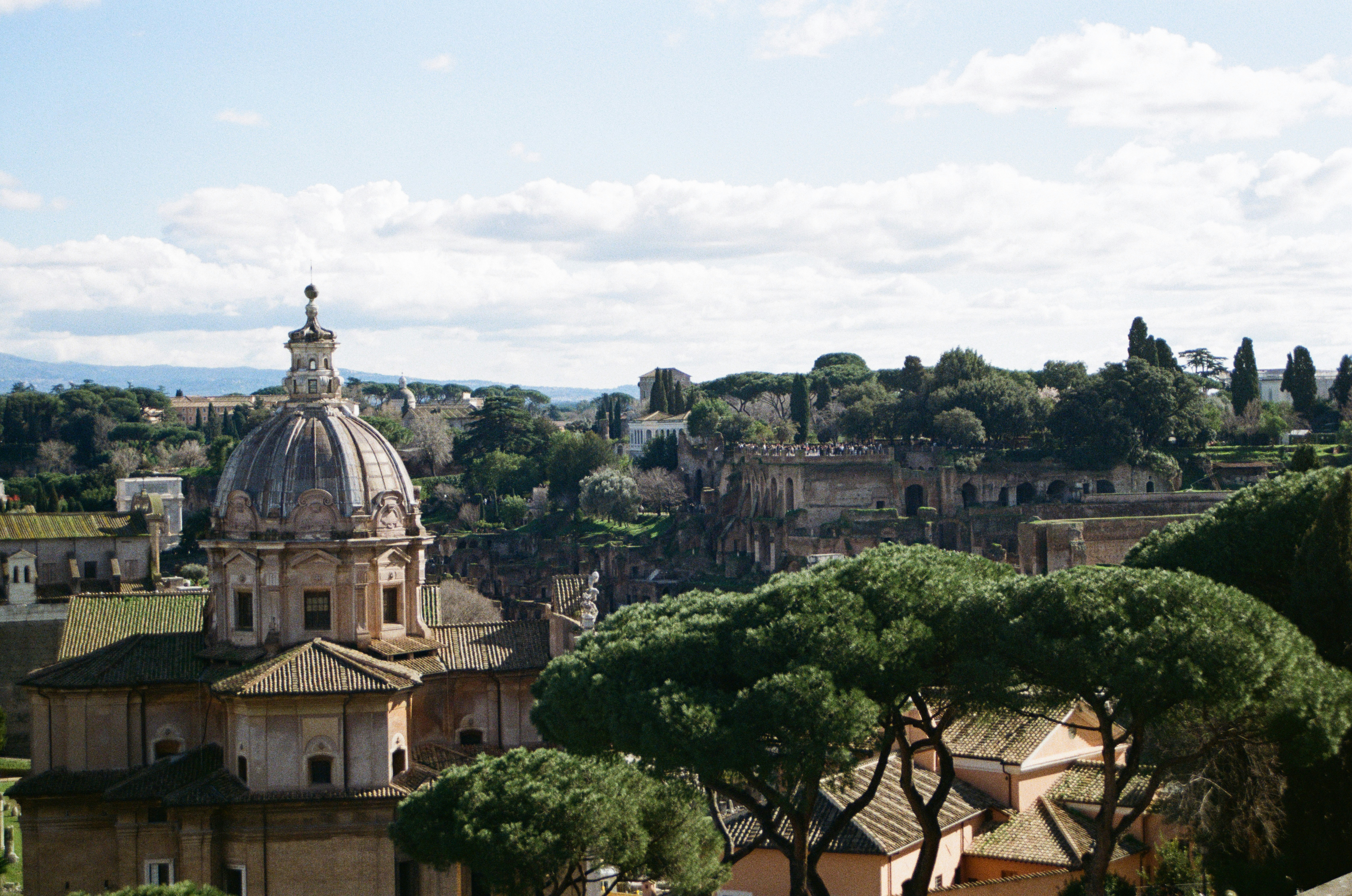 Historic roman architecture with lush green trees
