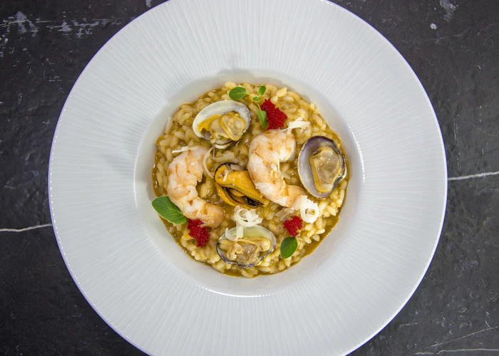 Seafood risotto with mussels, prawns and clams