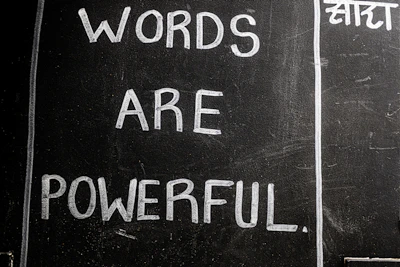 Words are powerful written on a blackboard.