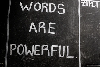 Words are powerful written on a blackboard