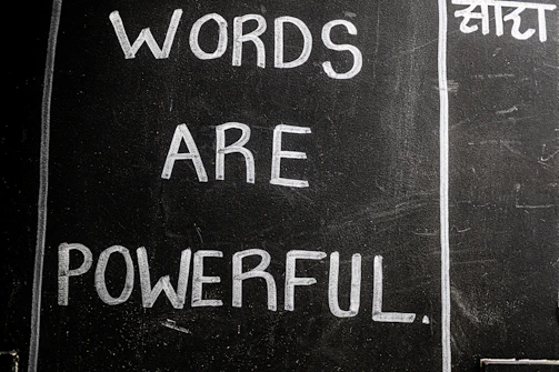 Words are powerful written on a blackboard.