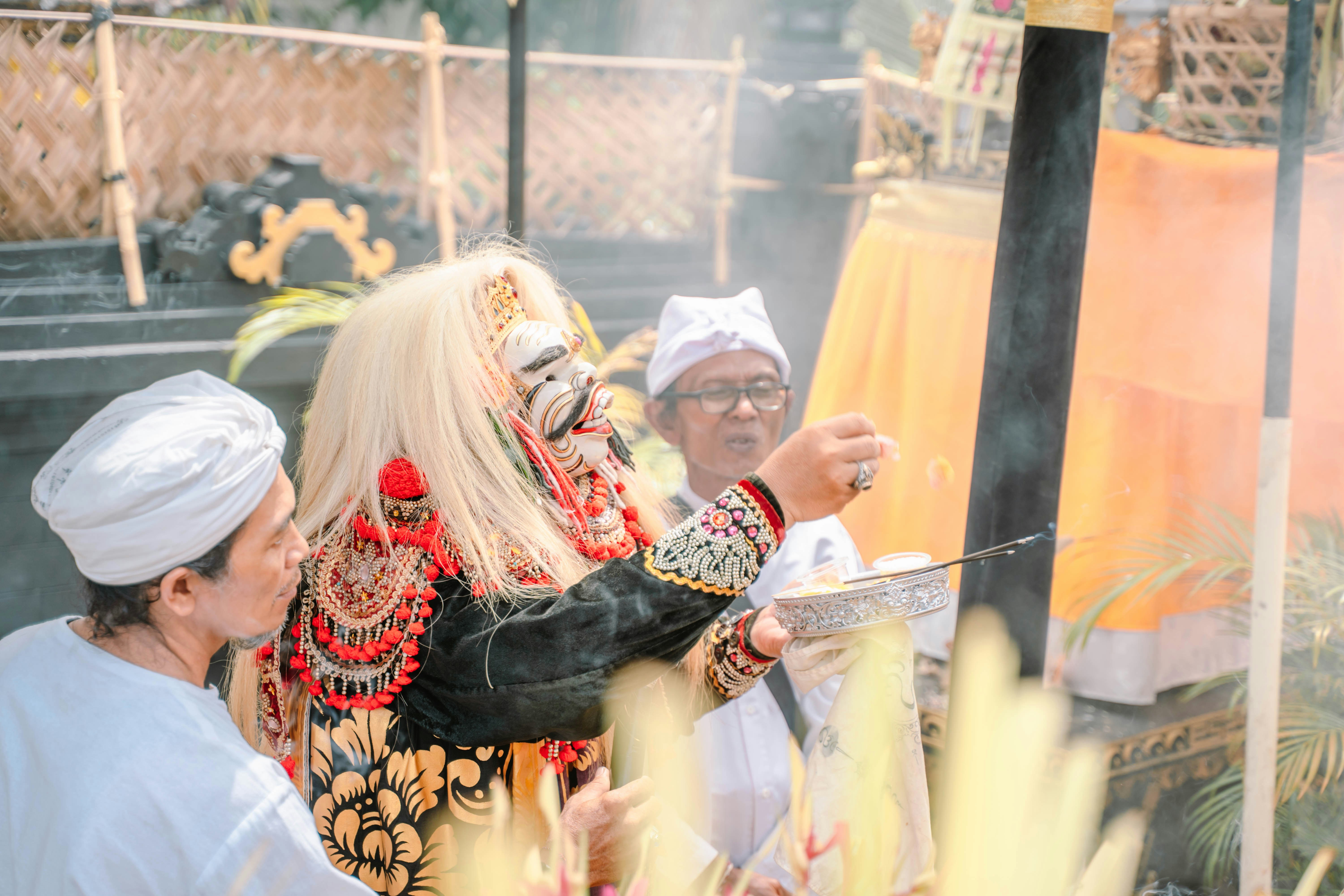 Dancers in traditional costumes perform a ritual