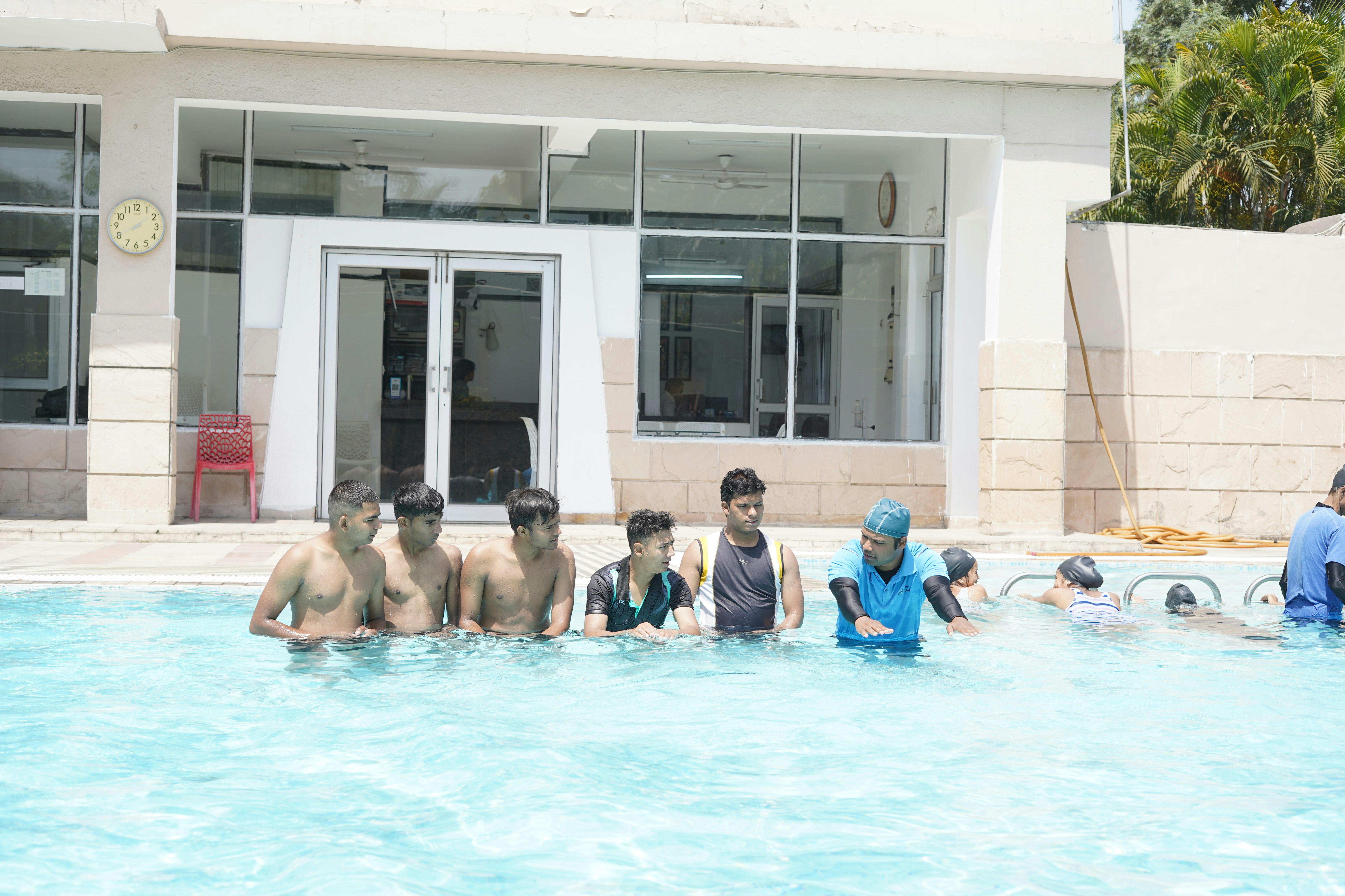 A group of people swimming in a pool