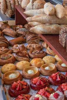 Assortment of fresh pastries and breads on display