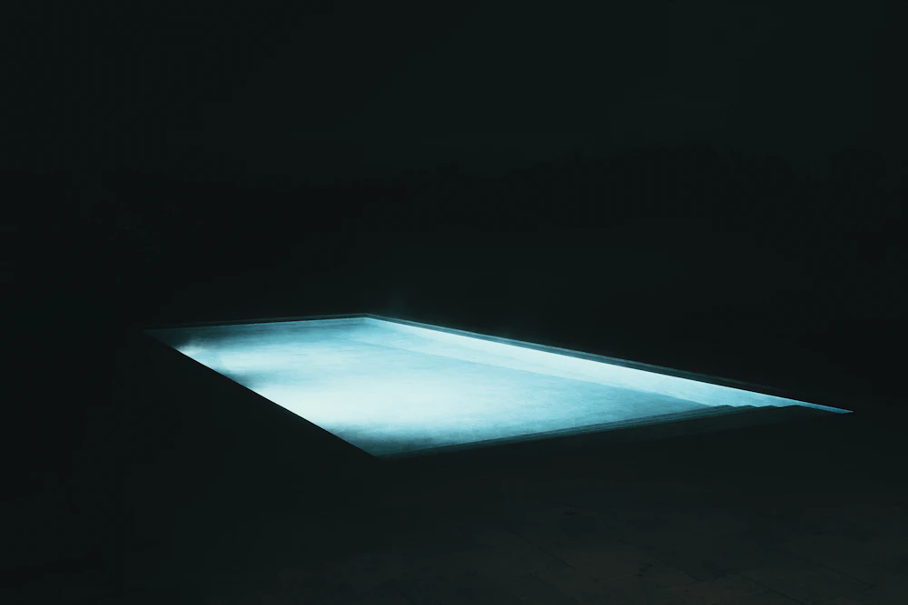 SwimJet pool at night with LED lighting