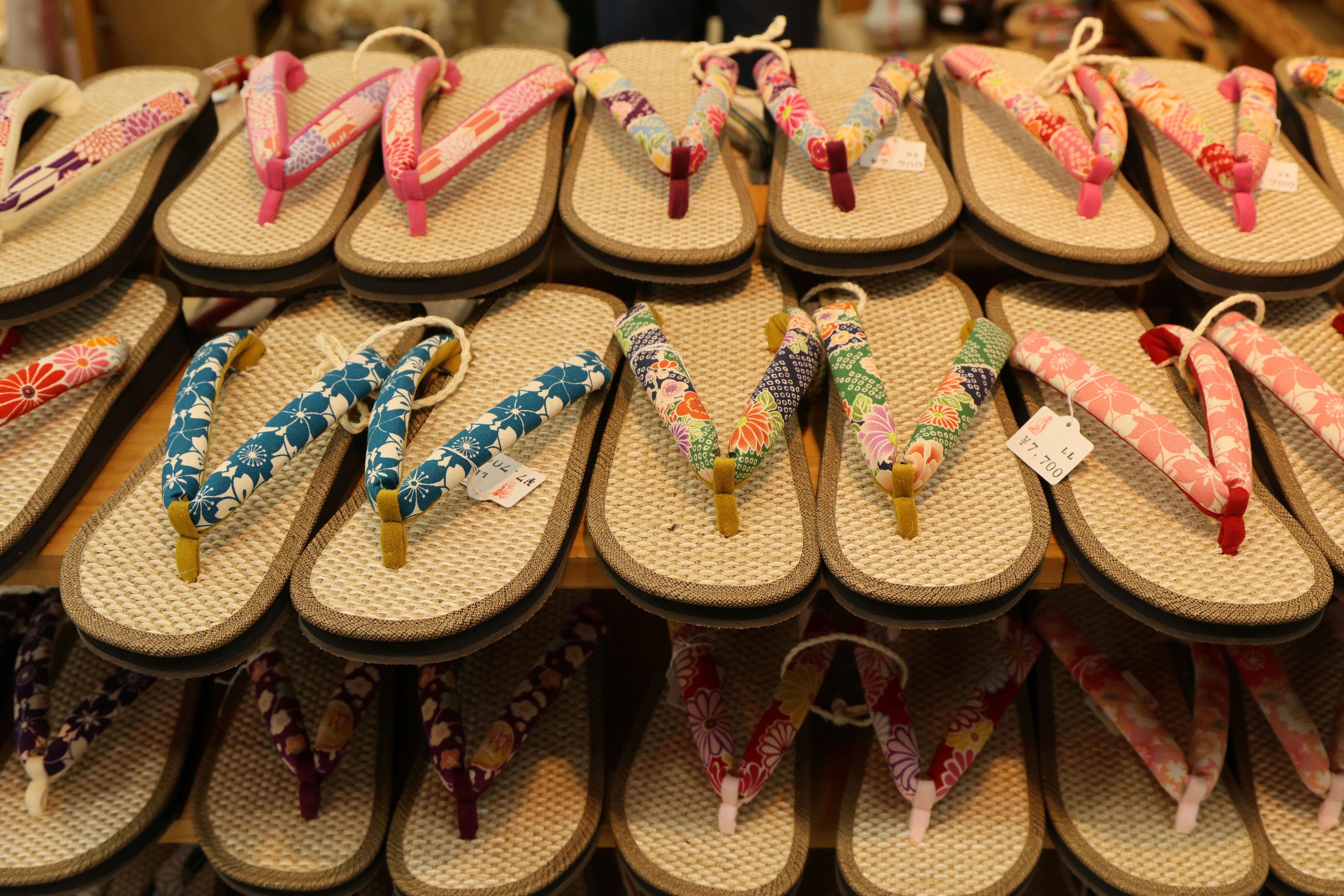 Rows of japanese geta sandals with floral patterns