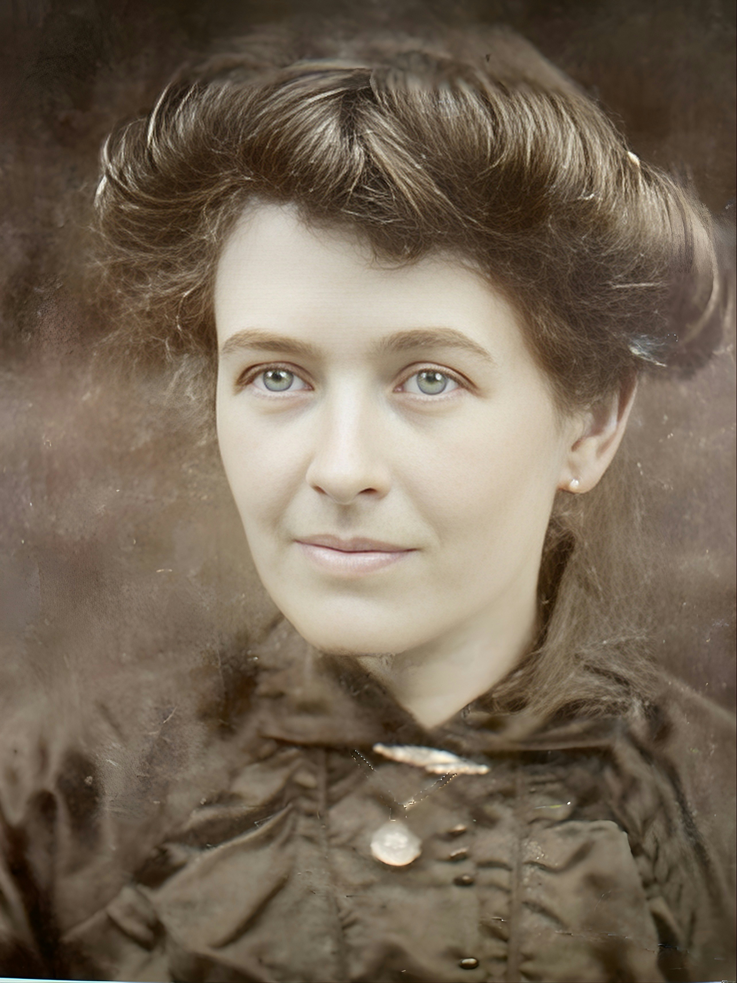 A vintage portrait of a woman with blue eyes