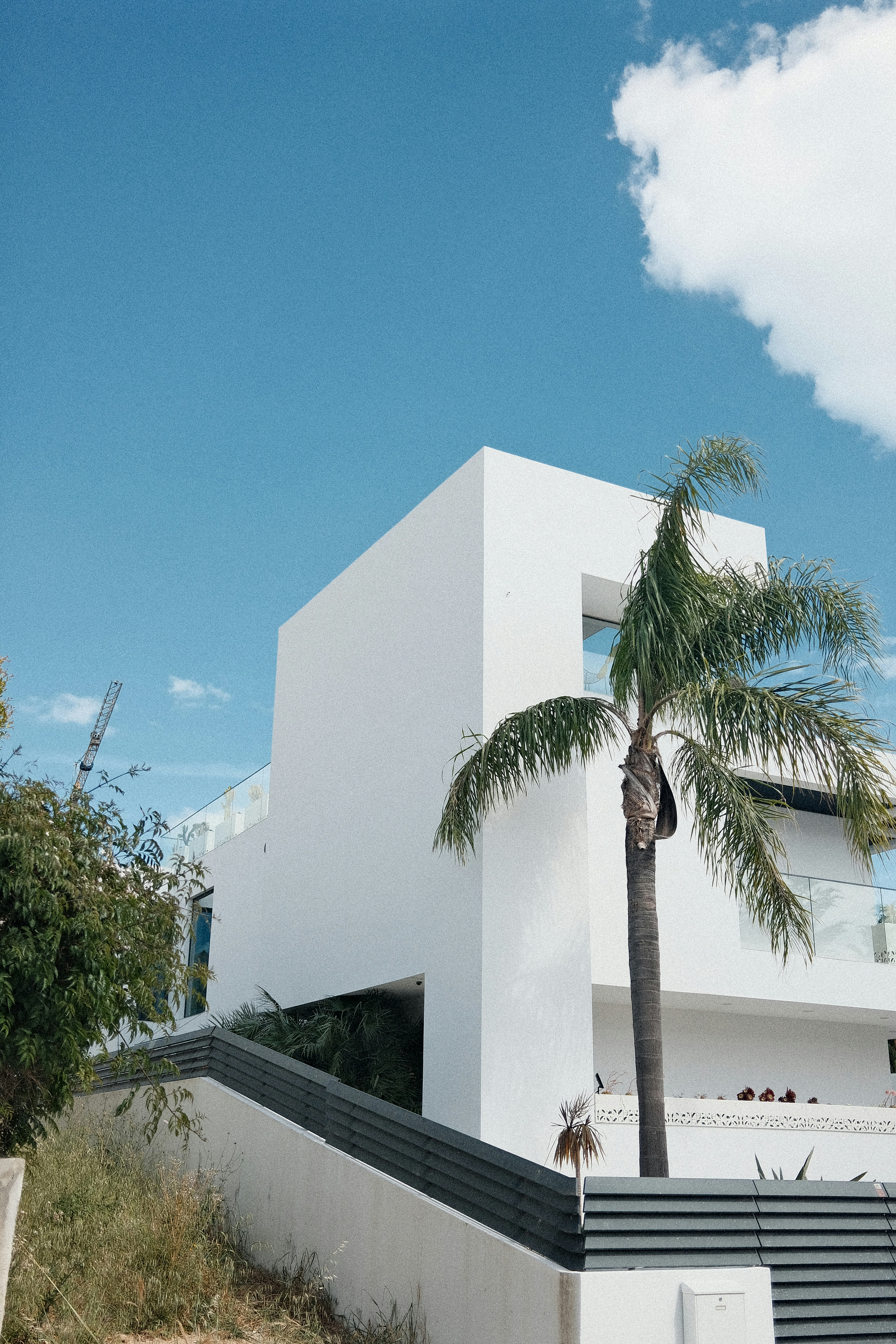 Modern waterfront residence representing coastal real estate investments and future-focused financing