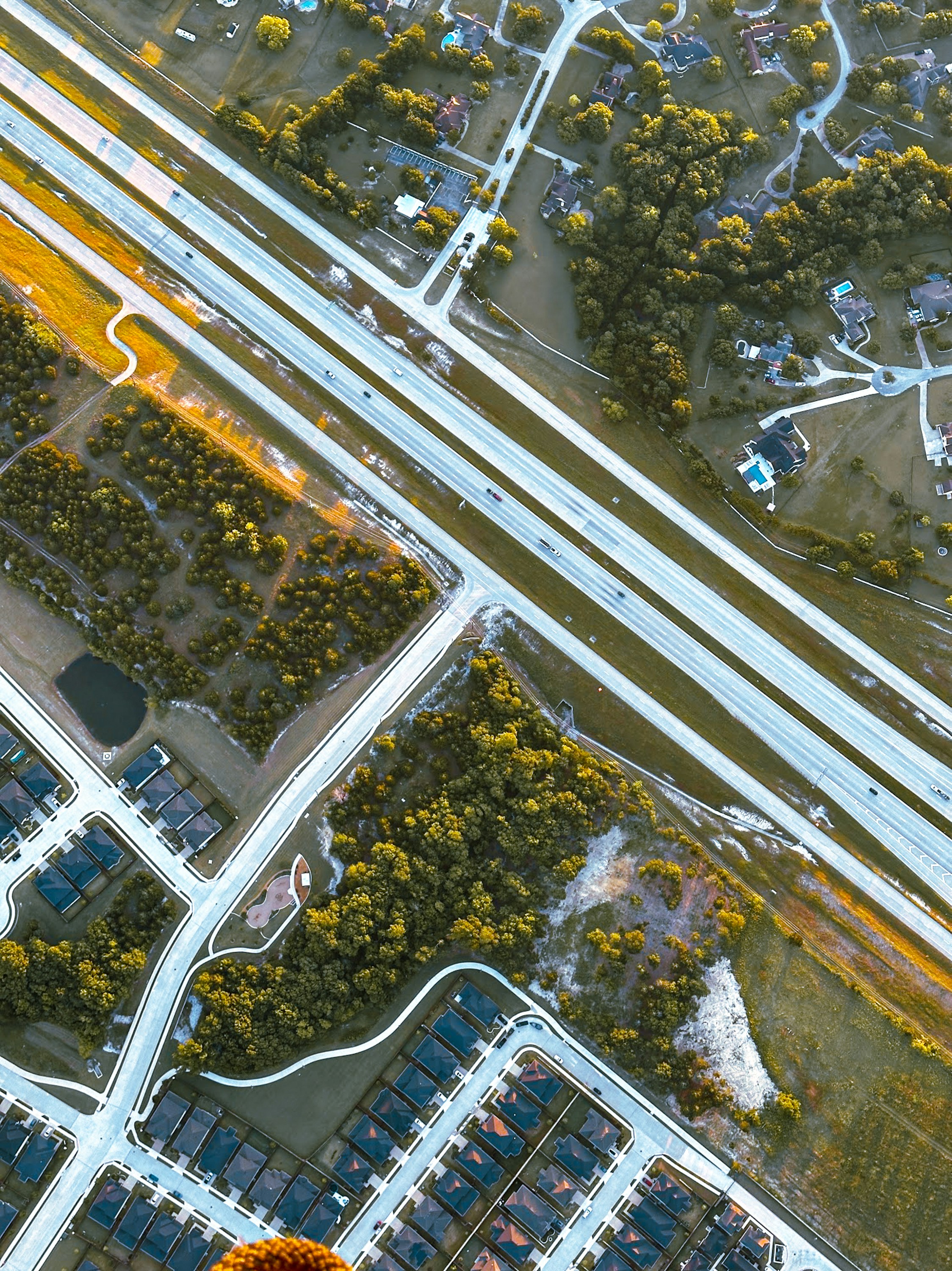 Aerial highway through a McKinney TX suburban neighborhood
