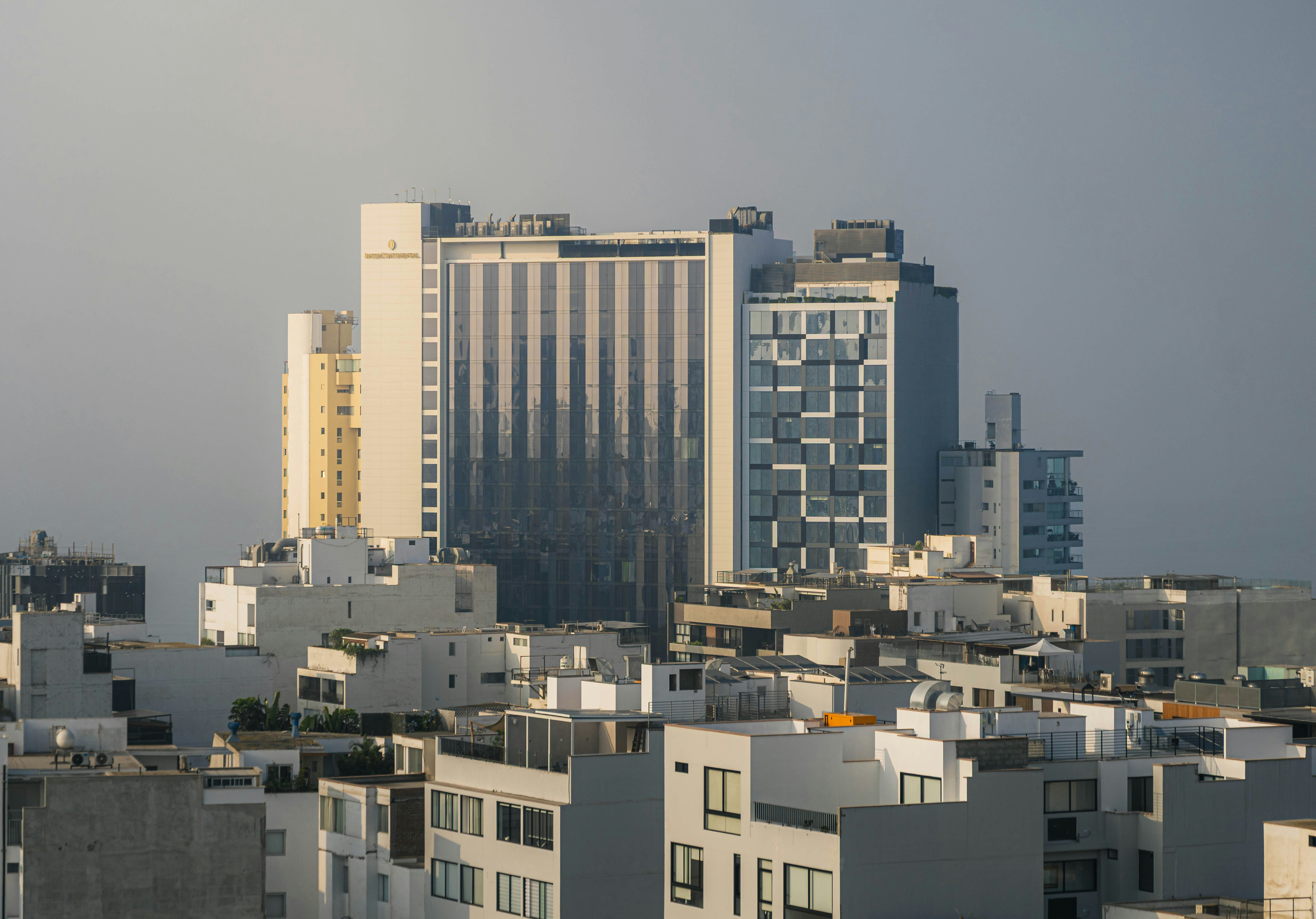Modern buildings in a city skyline at dusk