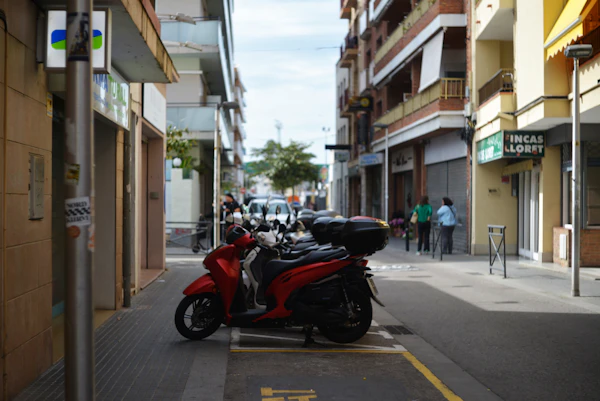 Red scooter on a narrow street