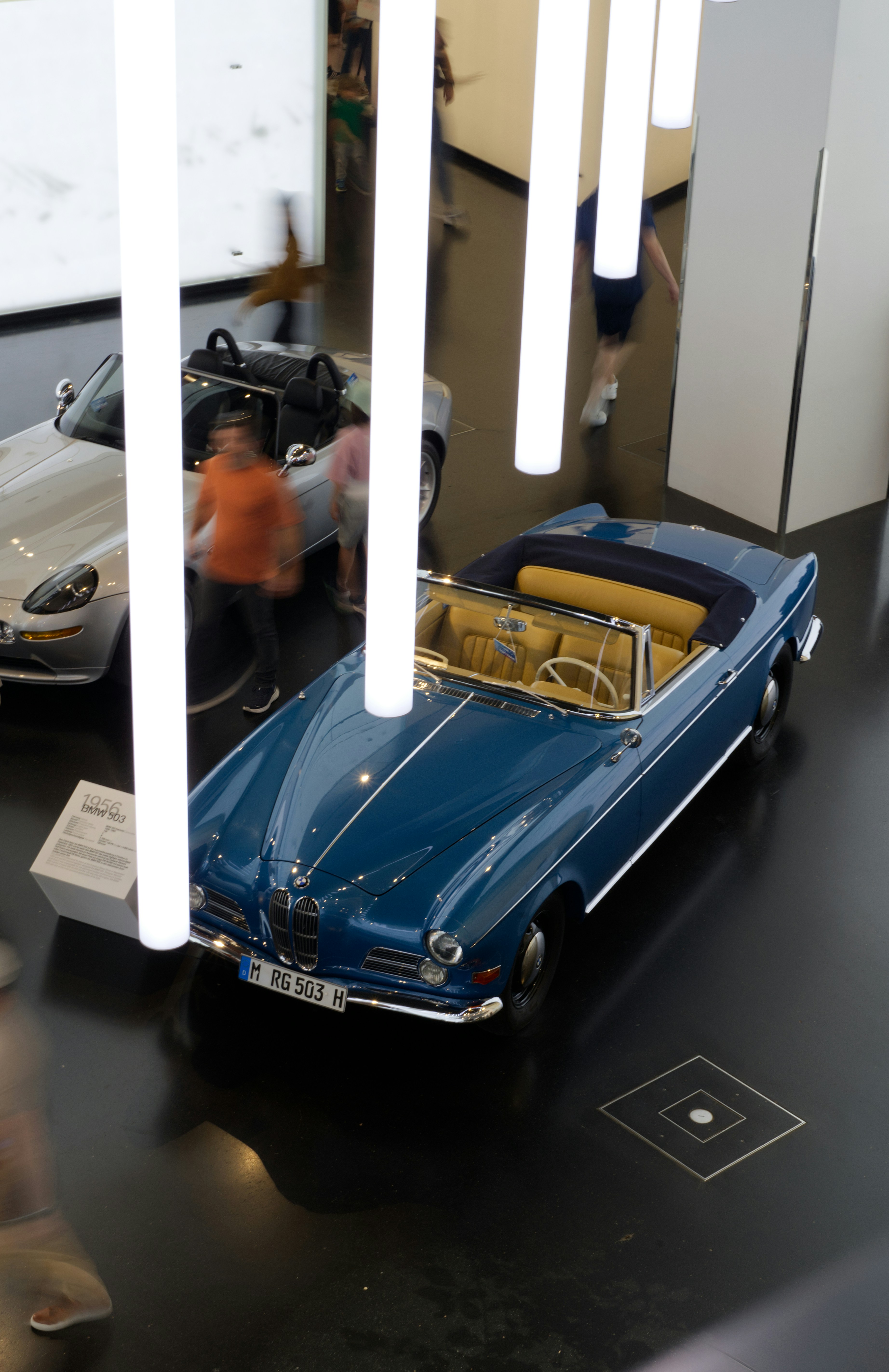 A vintage blue convertible car on display