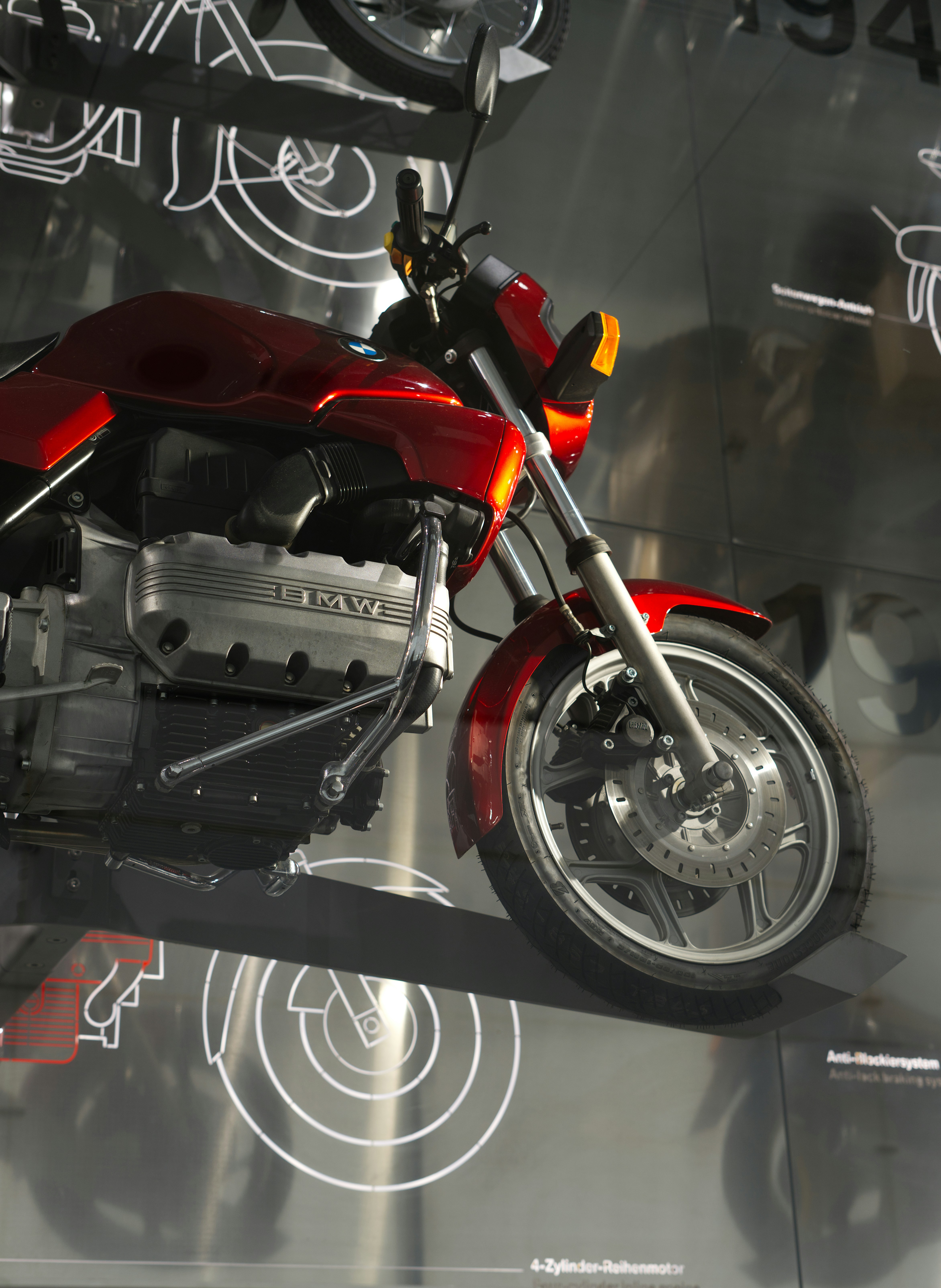 A shiny red motorcycle with a silver engine.