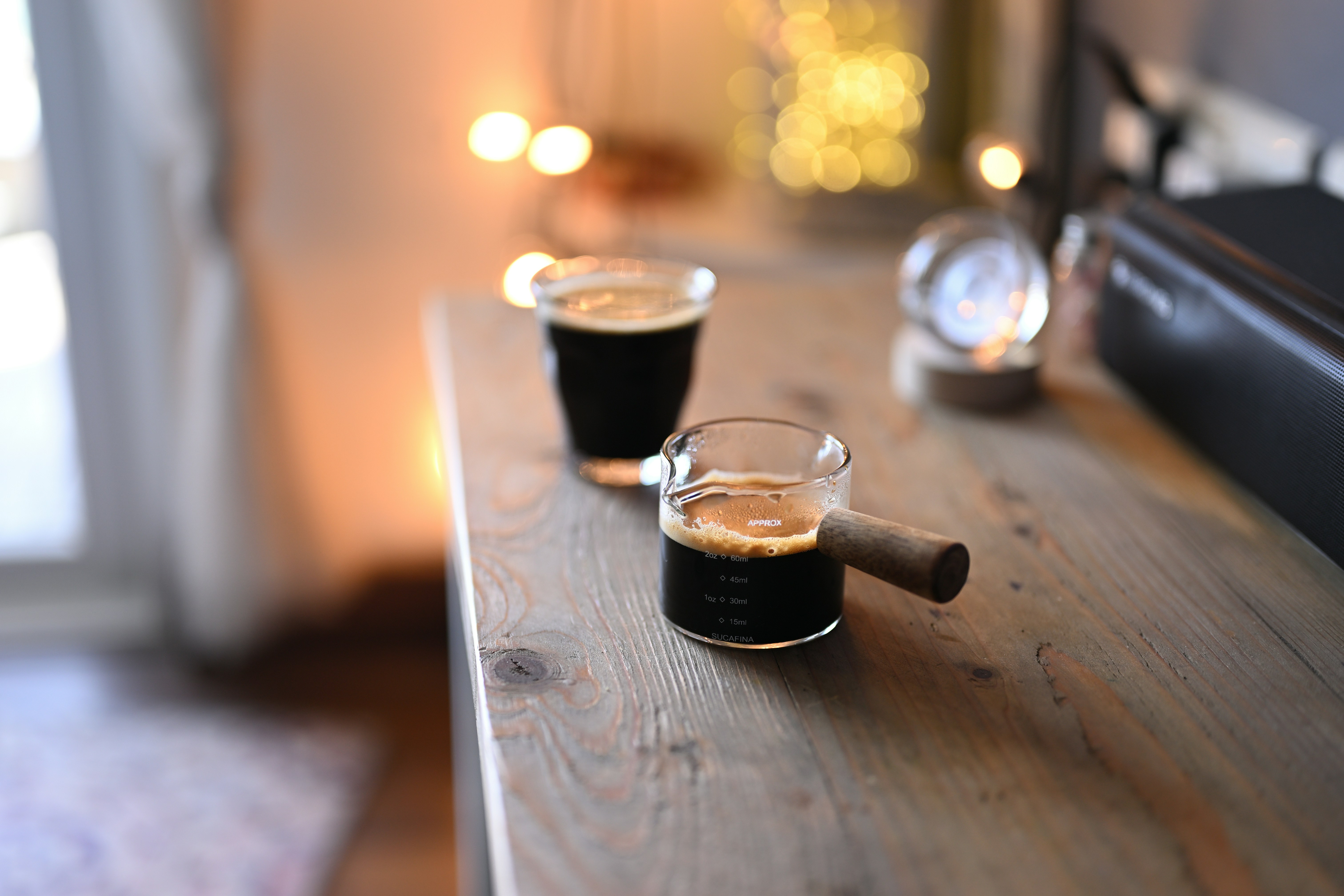 Two small glasses of dark espresso coffee