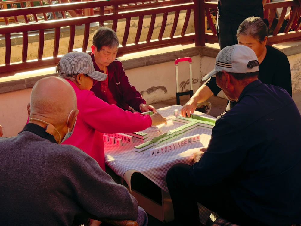 Group playing Mah Jongg outdoors