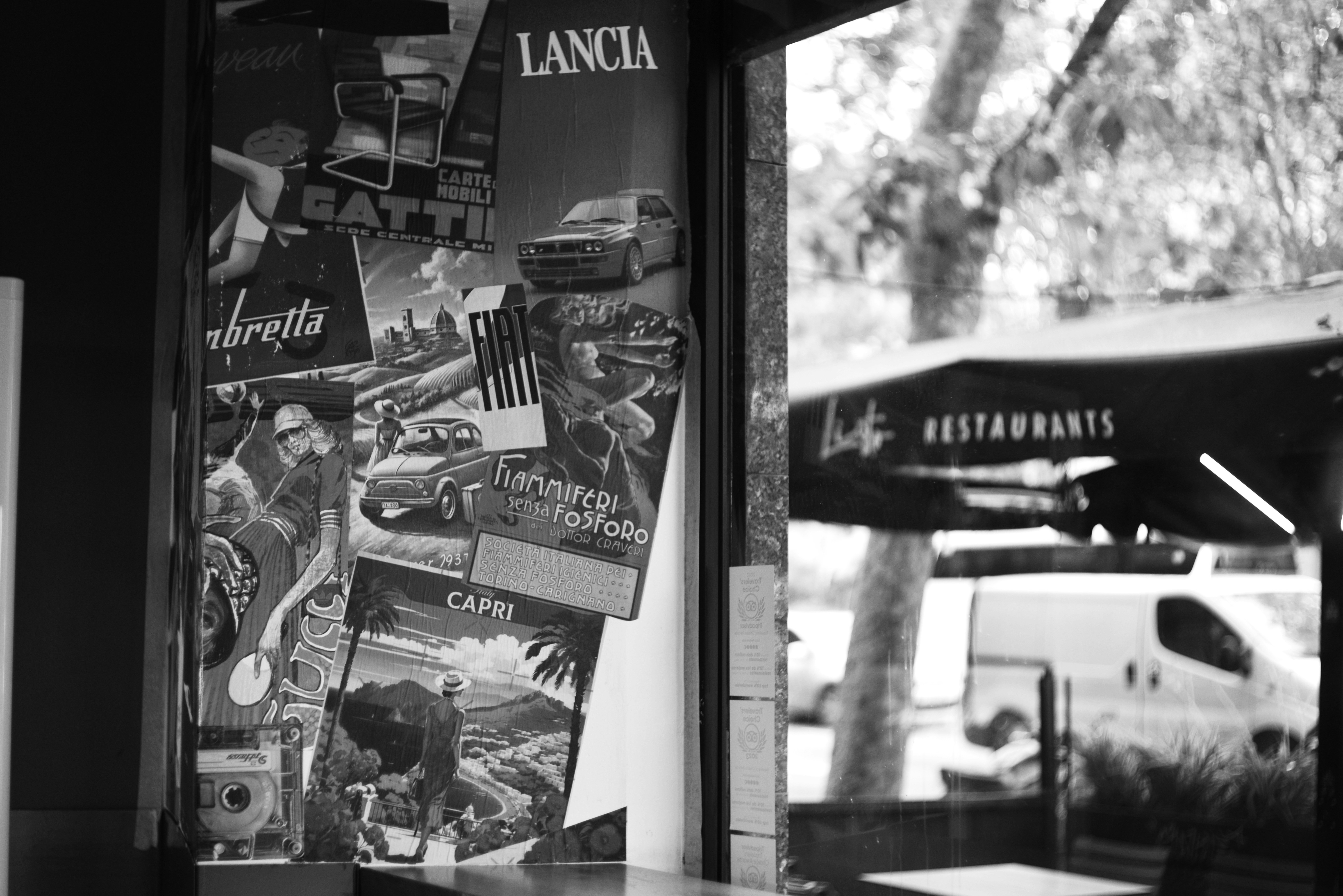 Collage of vintage lancia car advertisements and travel posters.
