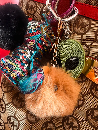 A collection of colorful, whimsical bag charms.