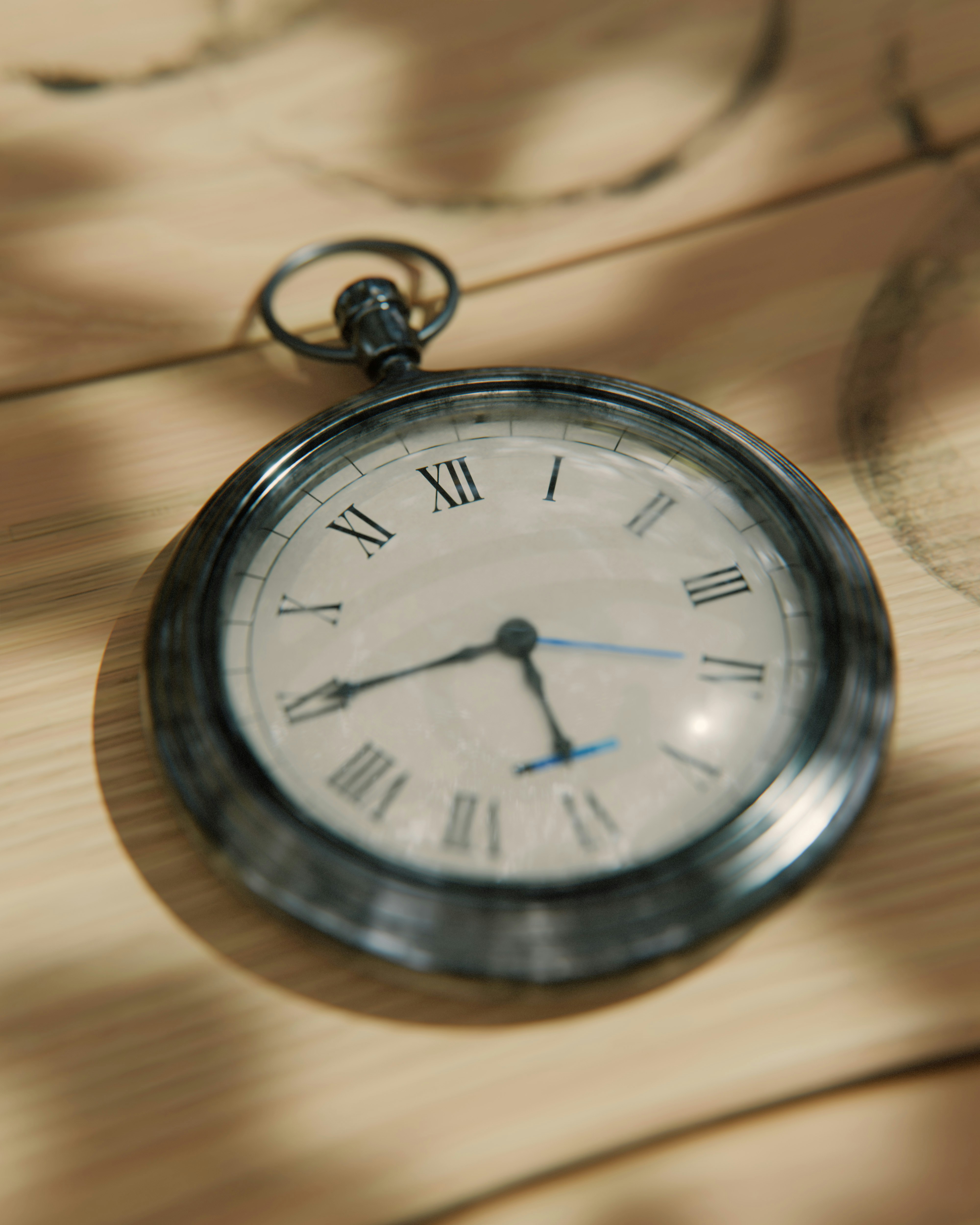 A vintage pocket watch rests on a wooden surface