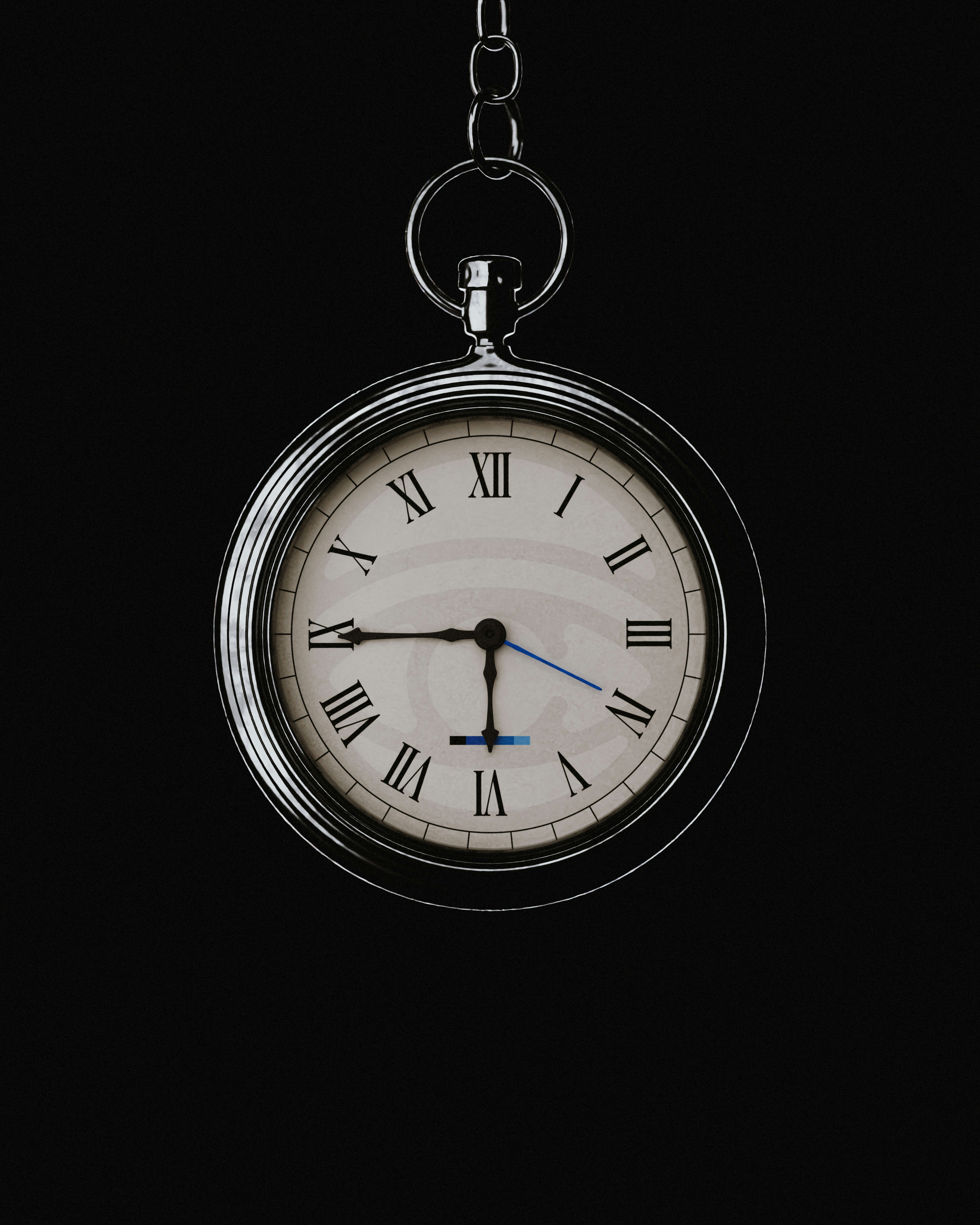 Silver pocket watch with roman numerals against a dark background