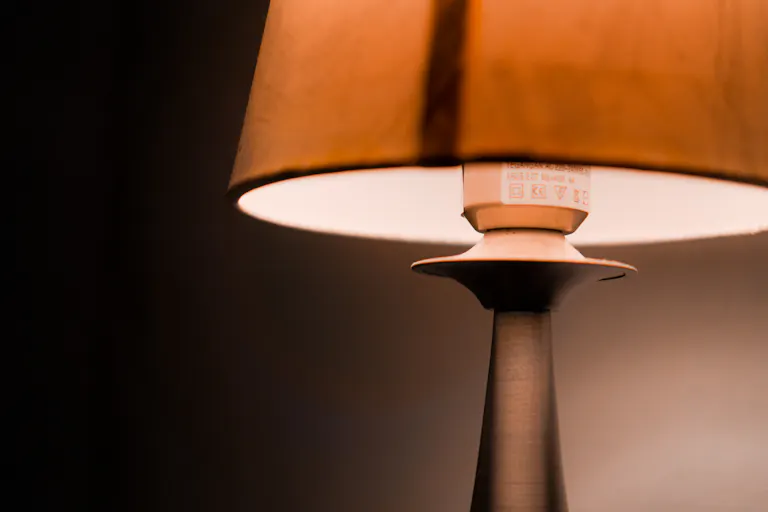 Close view of a table lamp casting soft warm light