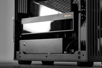 An nvidia graphics card inside a compact computer case.