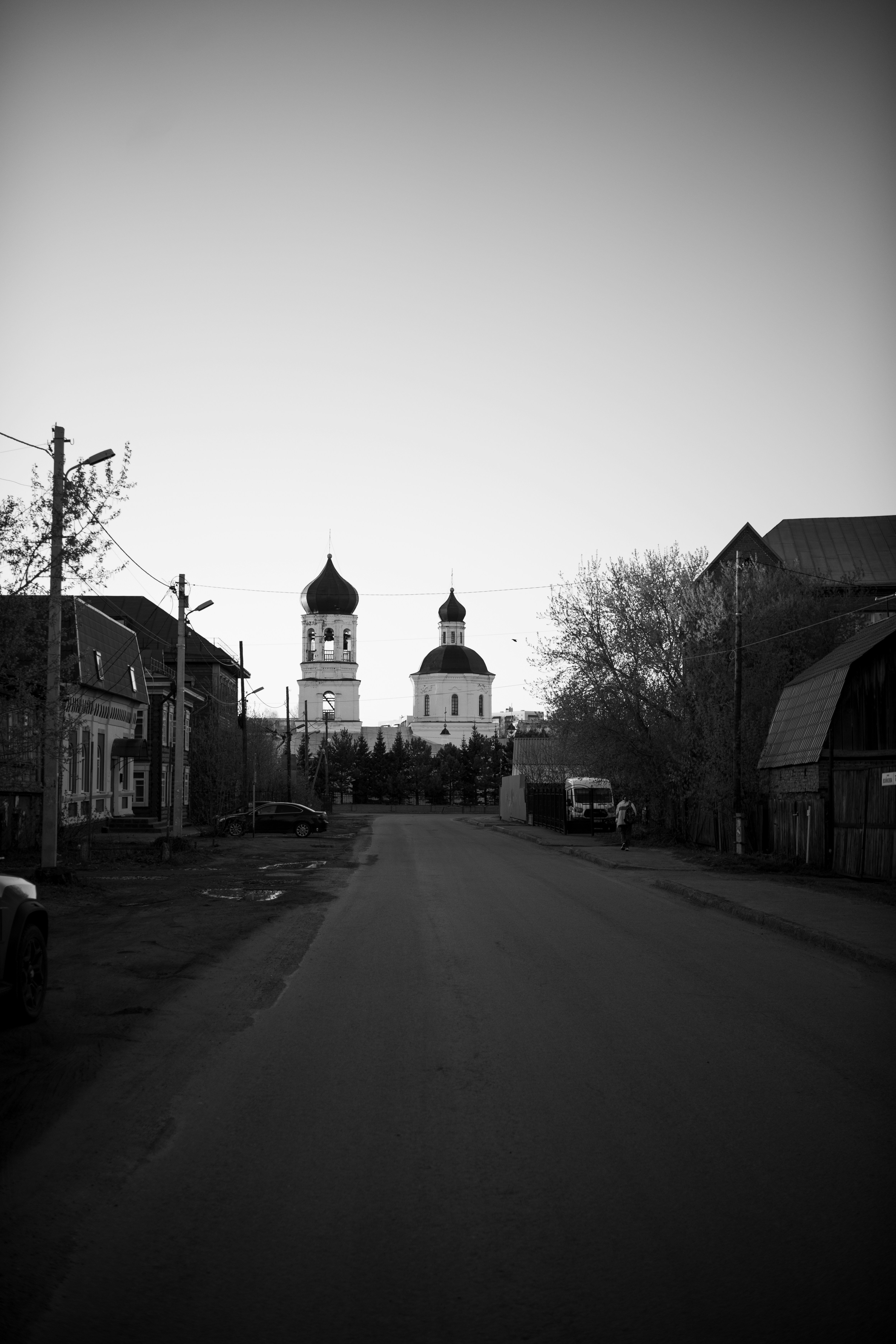 Street view with church and buildings at dusk