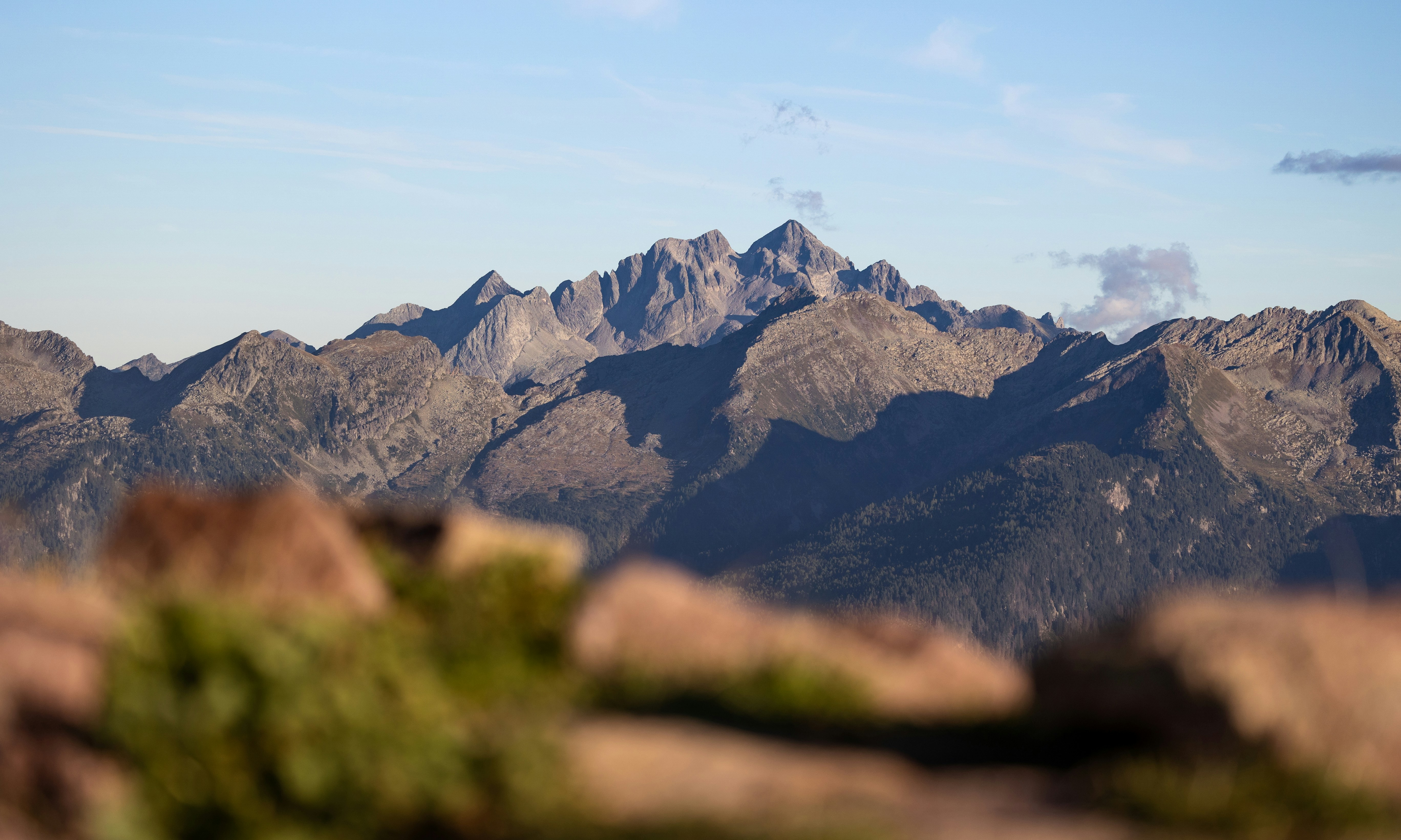 Jagged mountain peaks under a clear blue sky