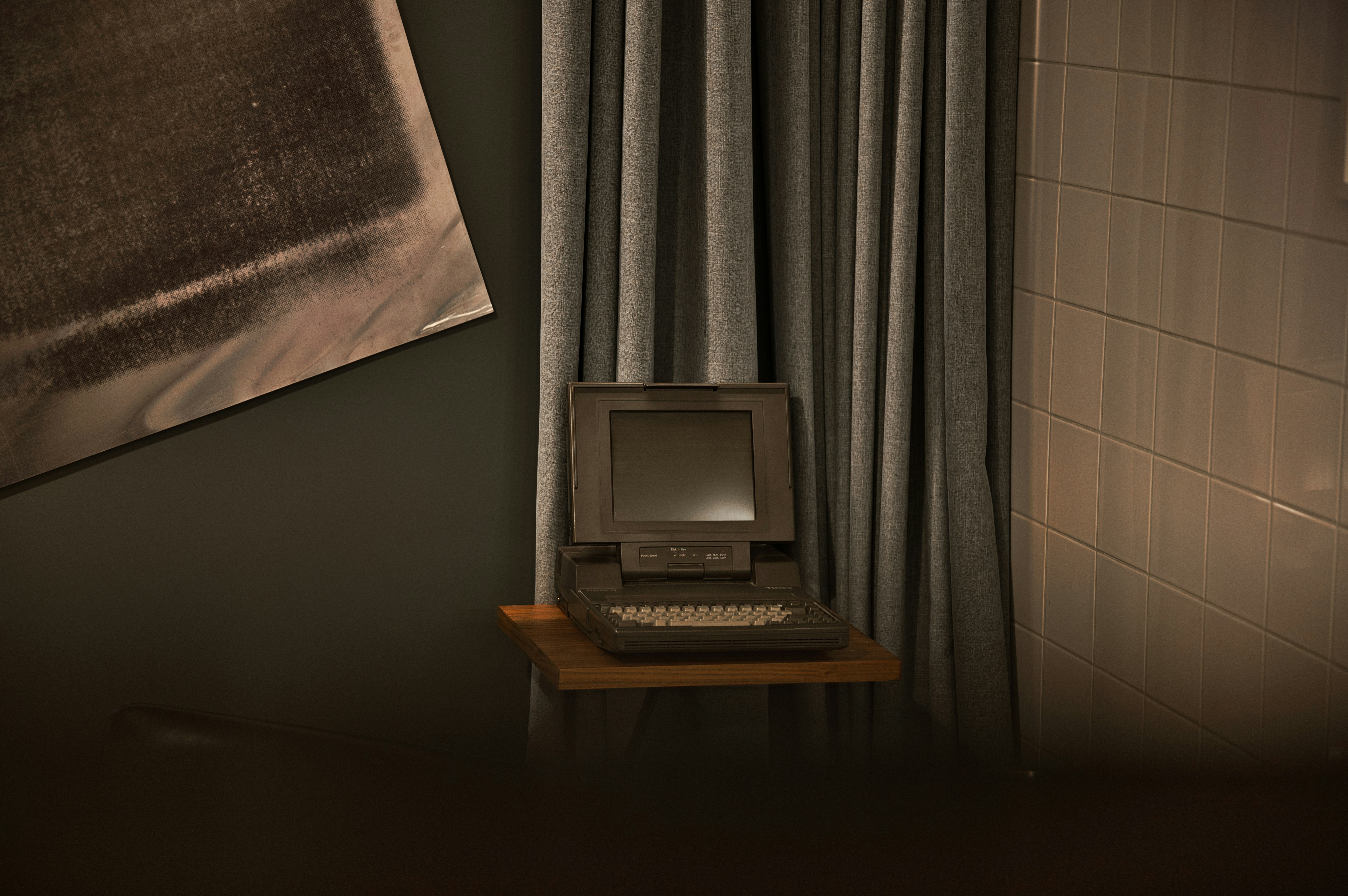 Old laptop on the small table