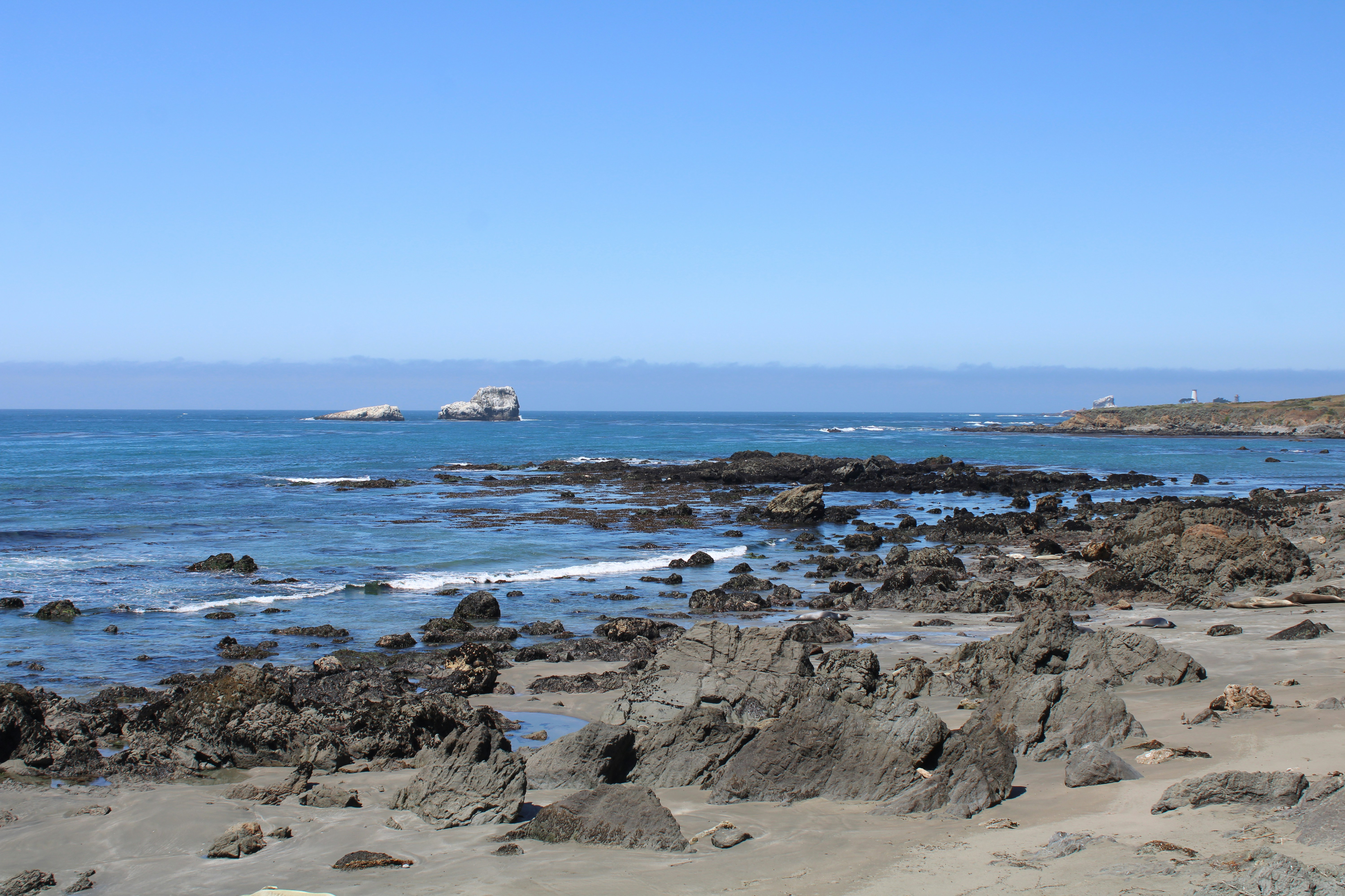 Rocky coastline with blue ocean and clear sky