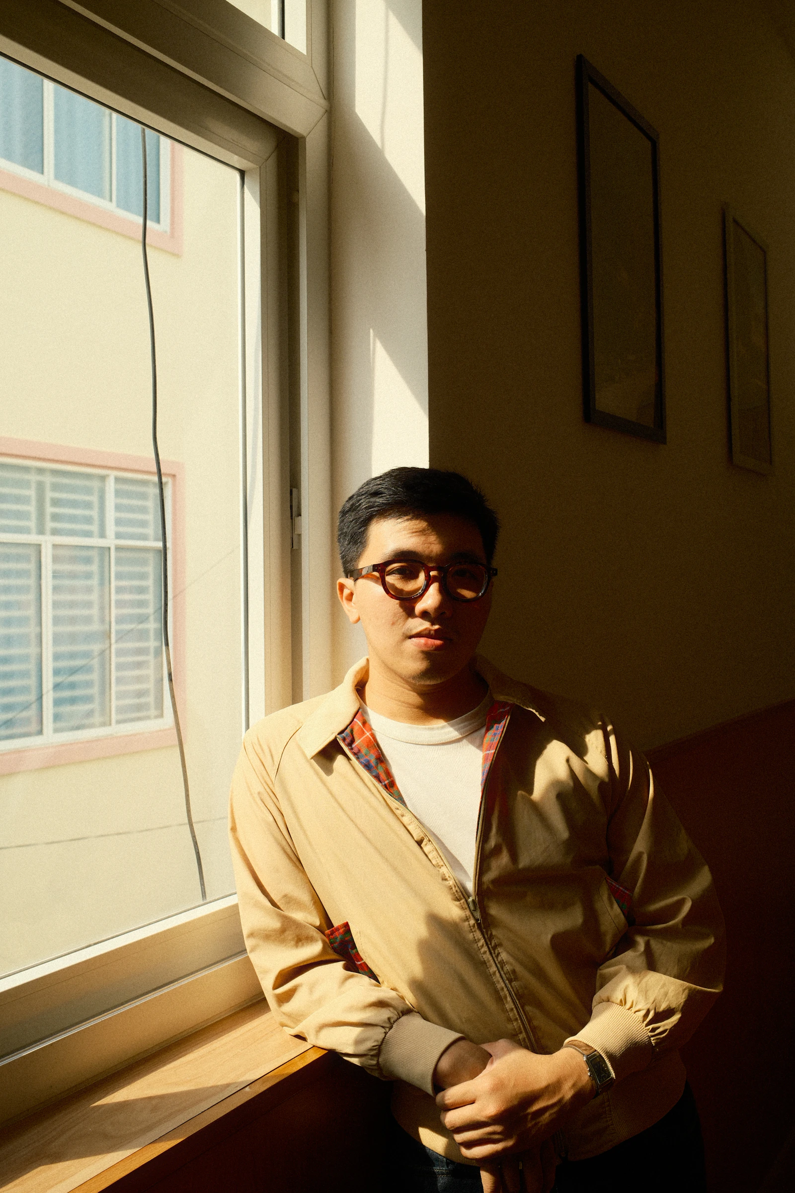 Man wearing modern optical frames in natural daylight