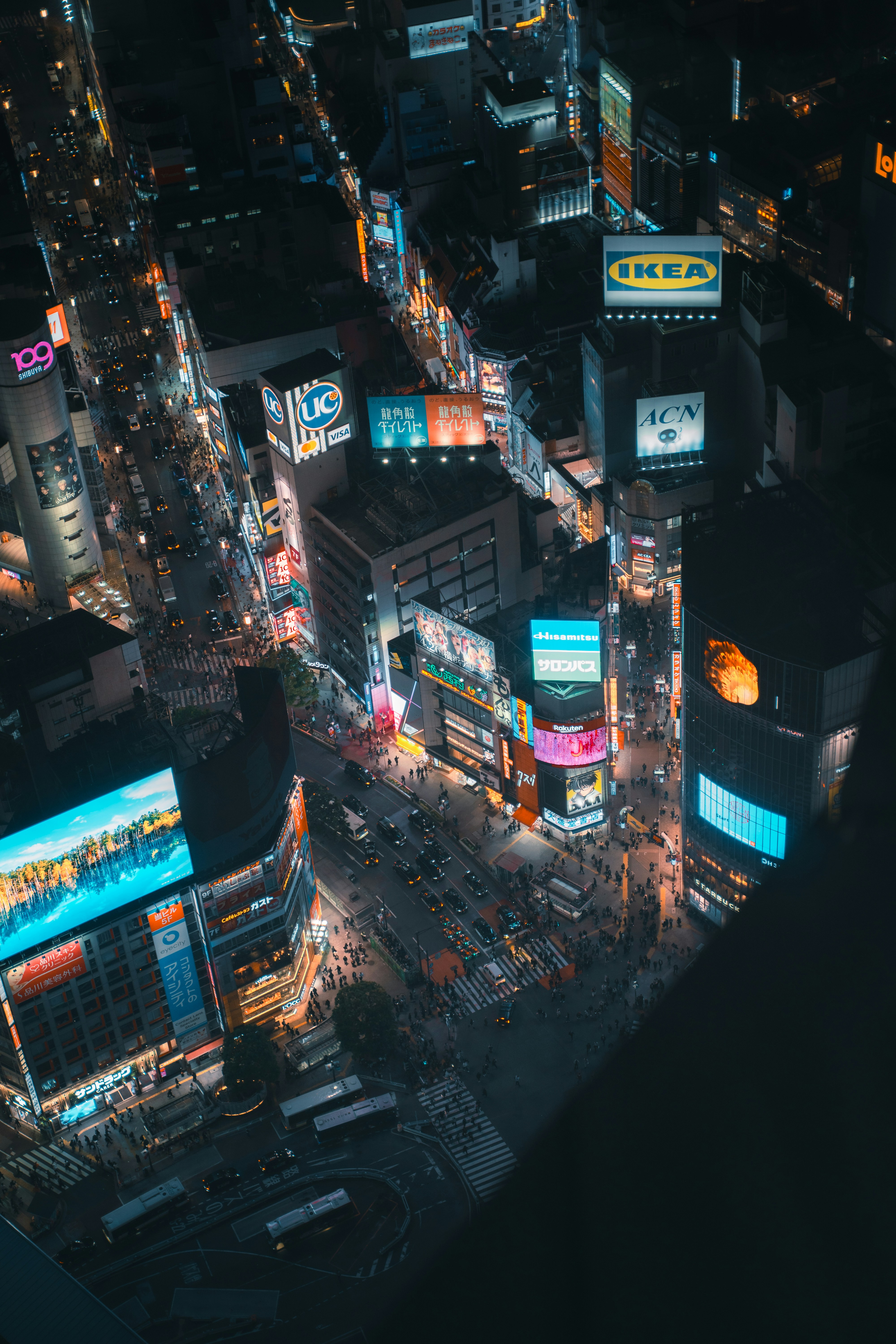 Aerial view of a bustling city street at night.