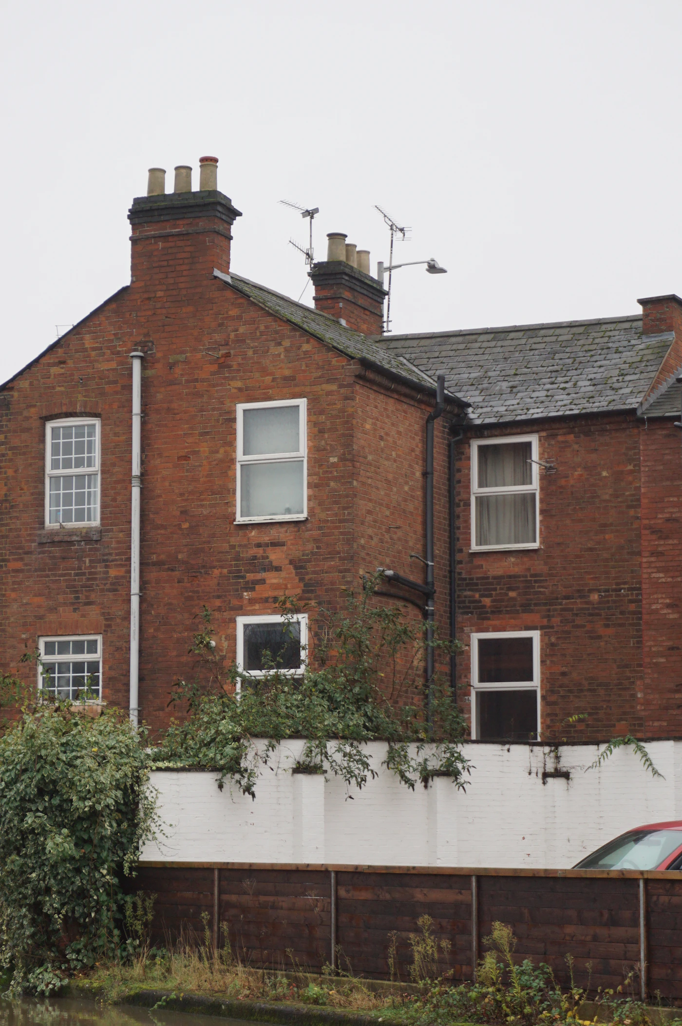 A red brick building with white windows