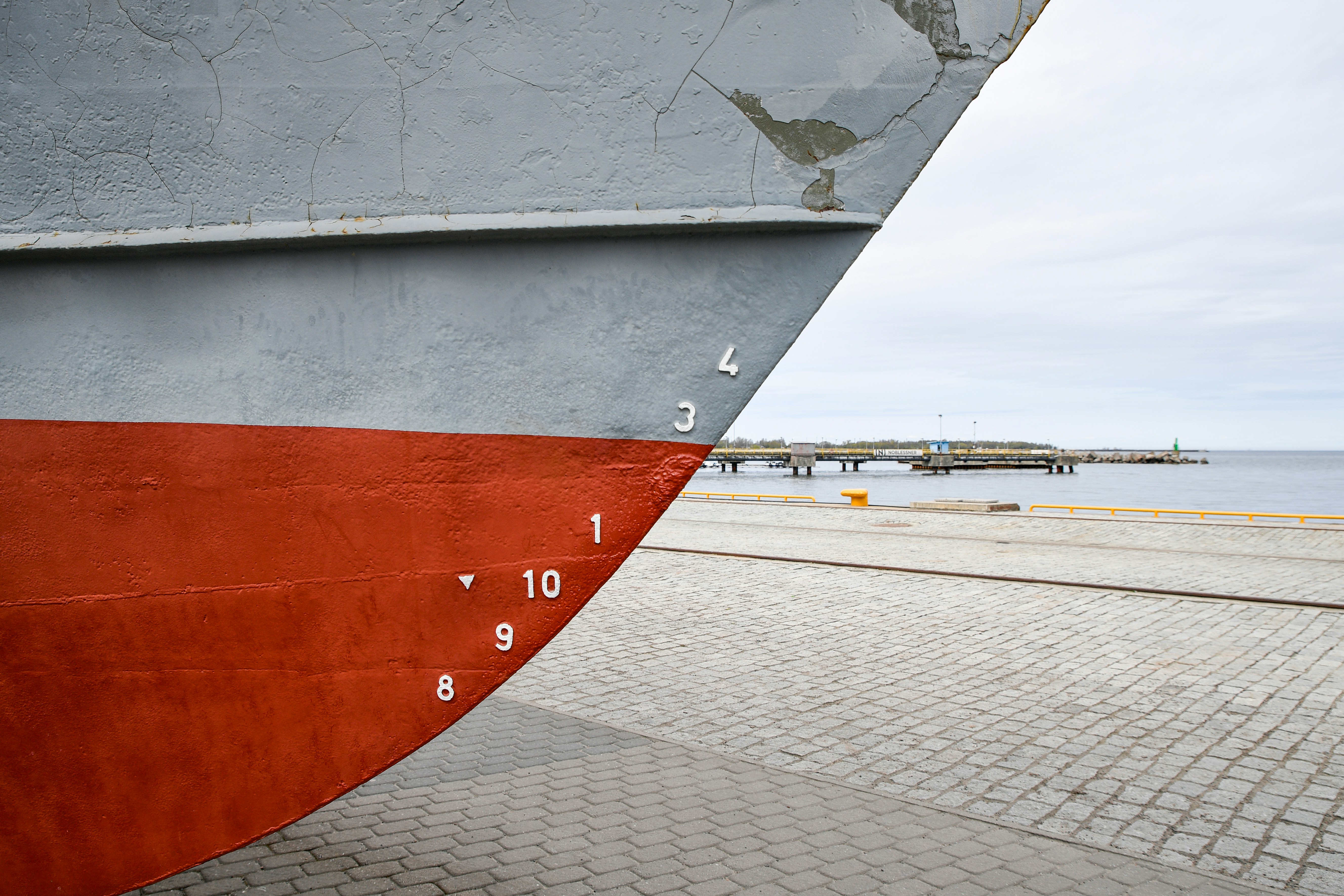 Close-up of a ship's hull with water depth markers.