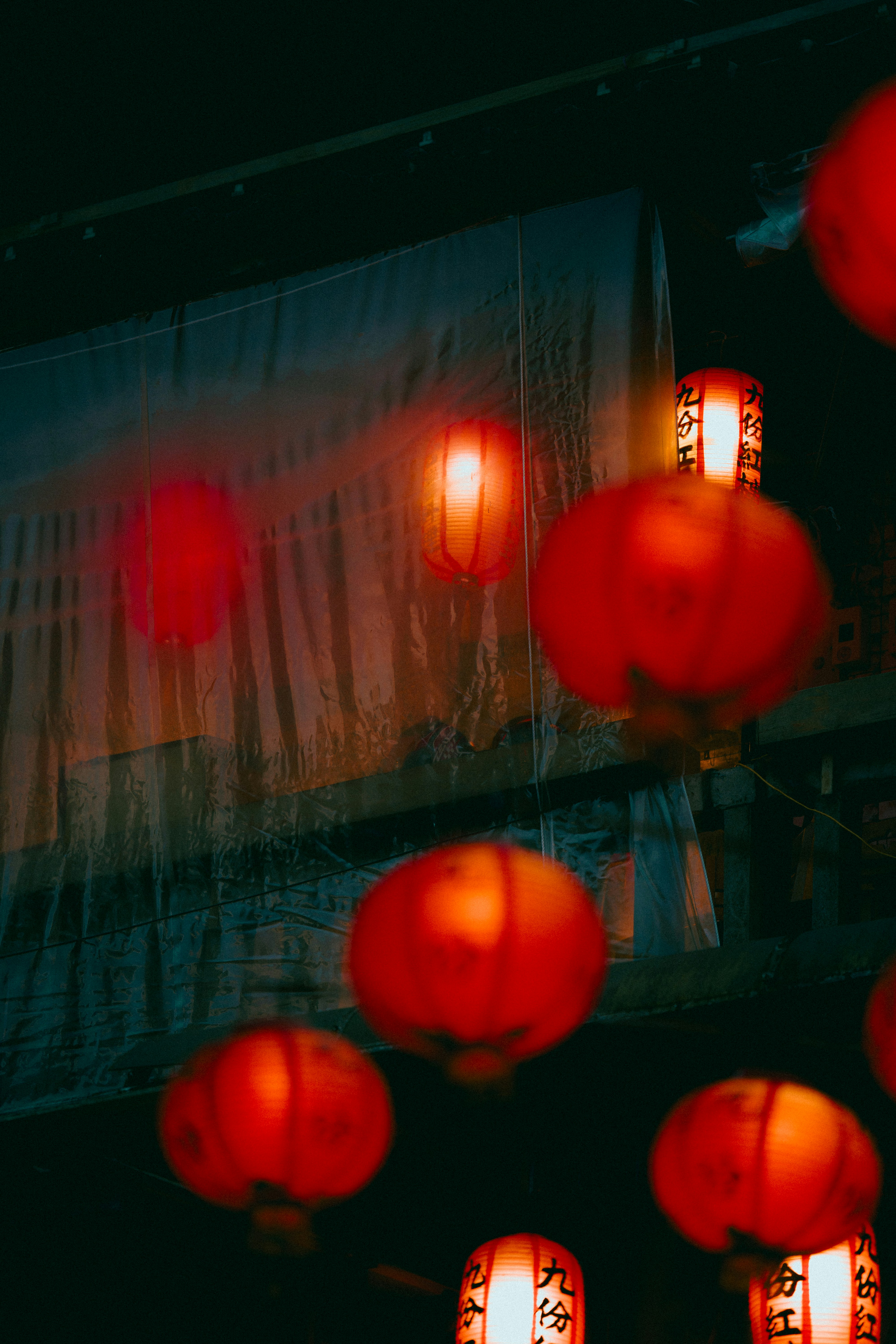 Several red lanterns glowing at night