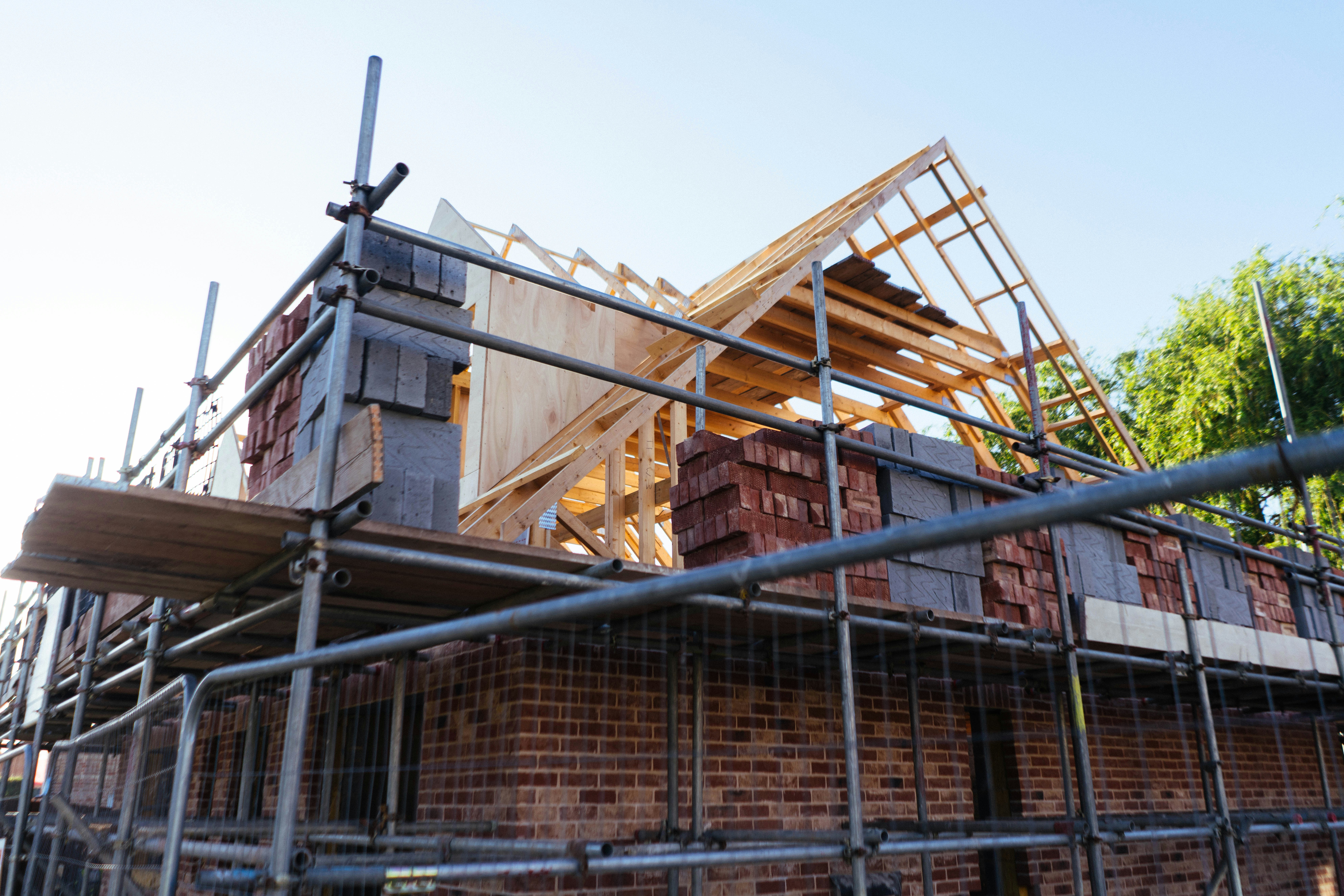 House construction with scaffolding and brickwork
