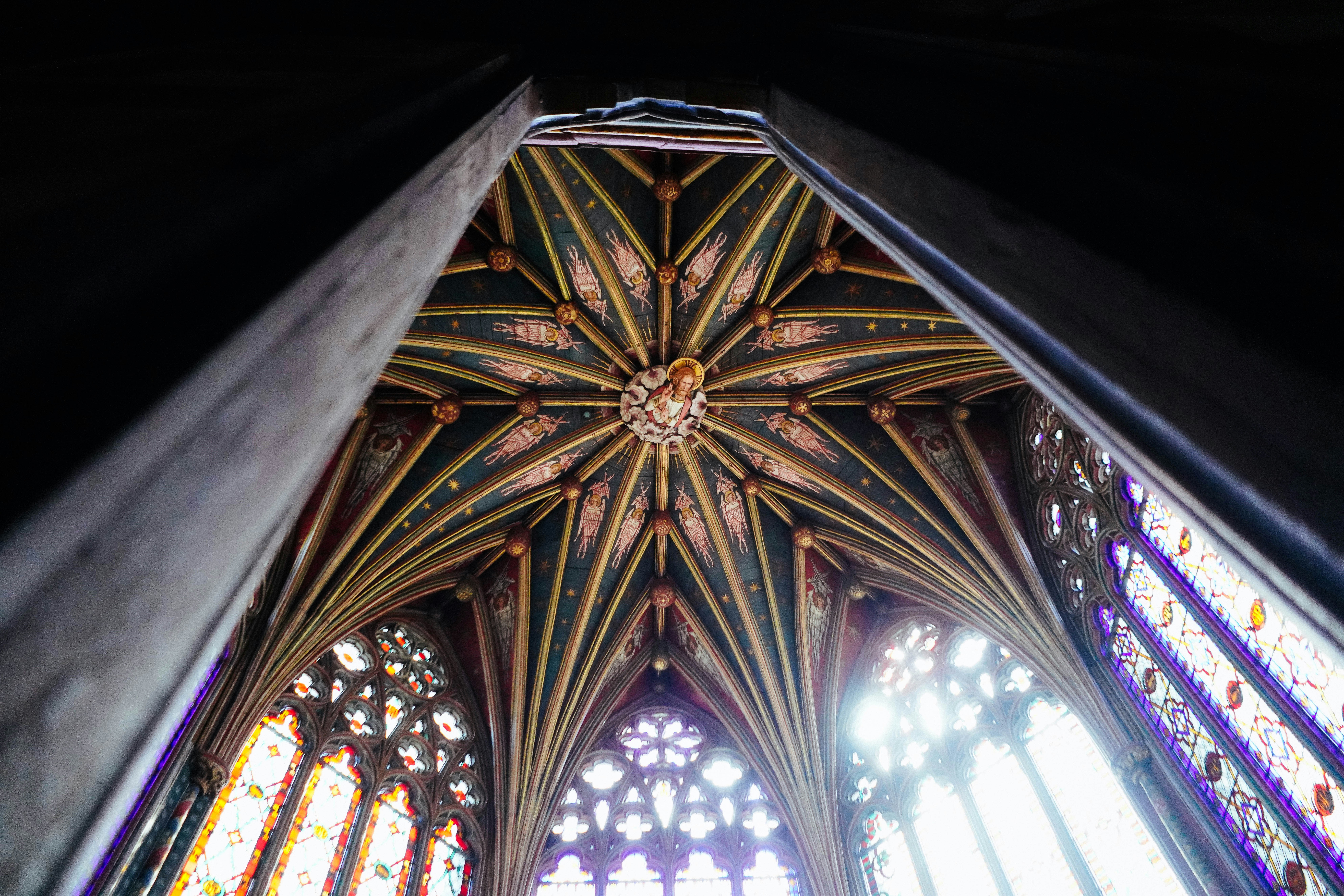 Intricate gothic ceiling with stained glass windows