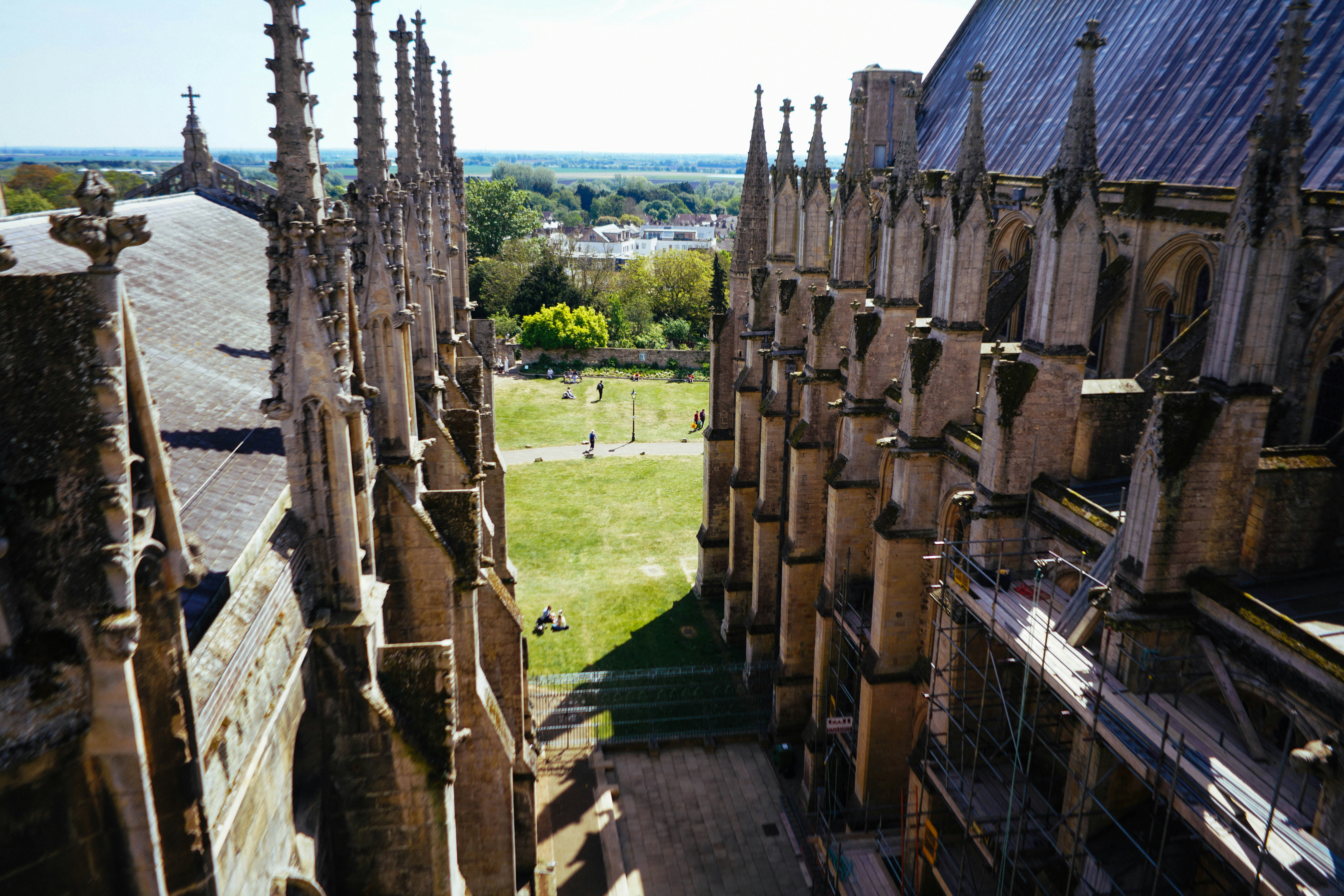 Gothic architecture with a green lawn and trees