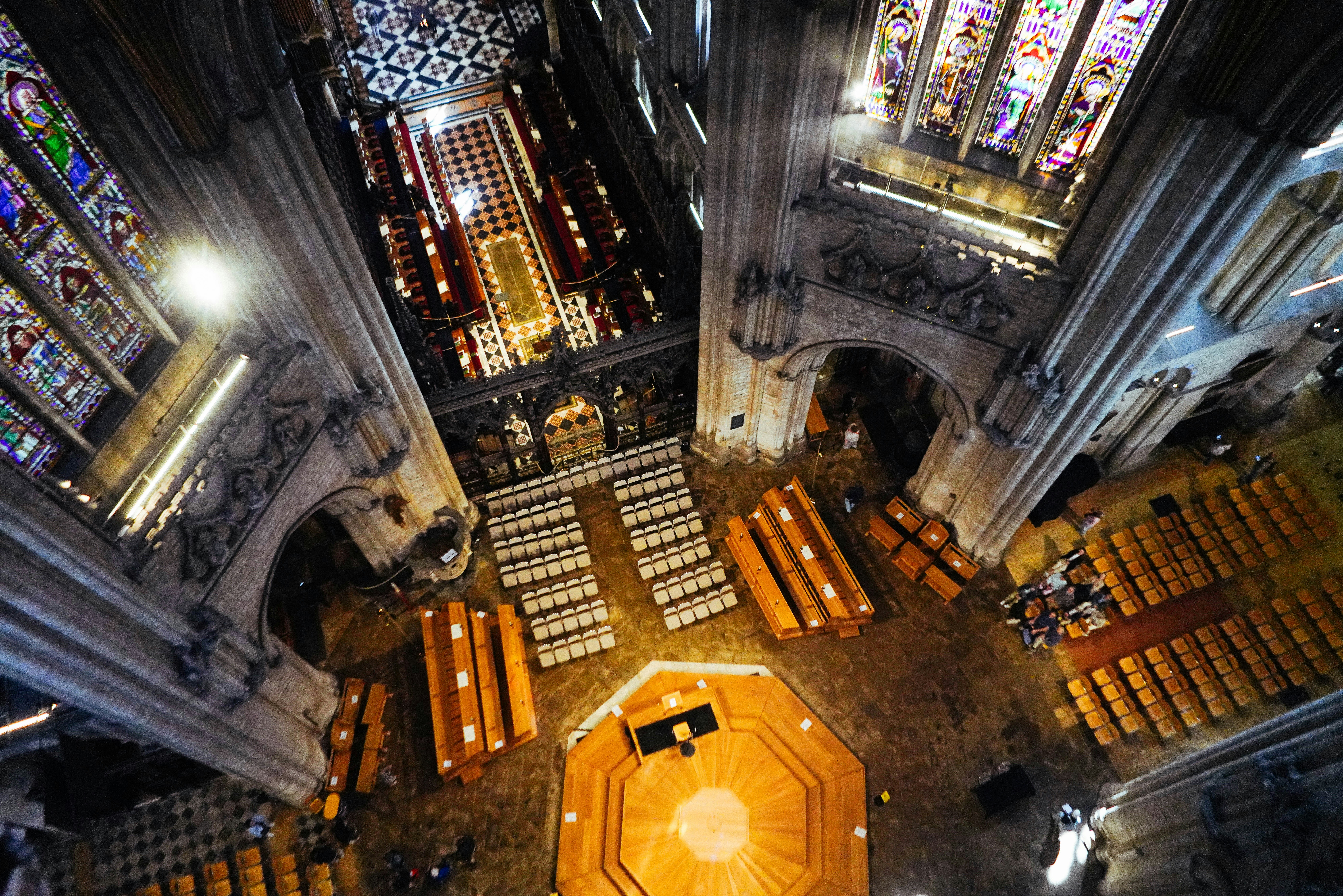 Aerial view of a cathedral with rows of pews.