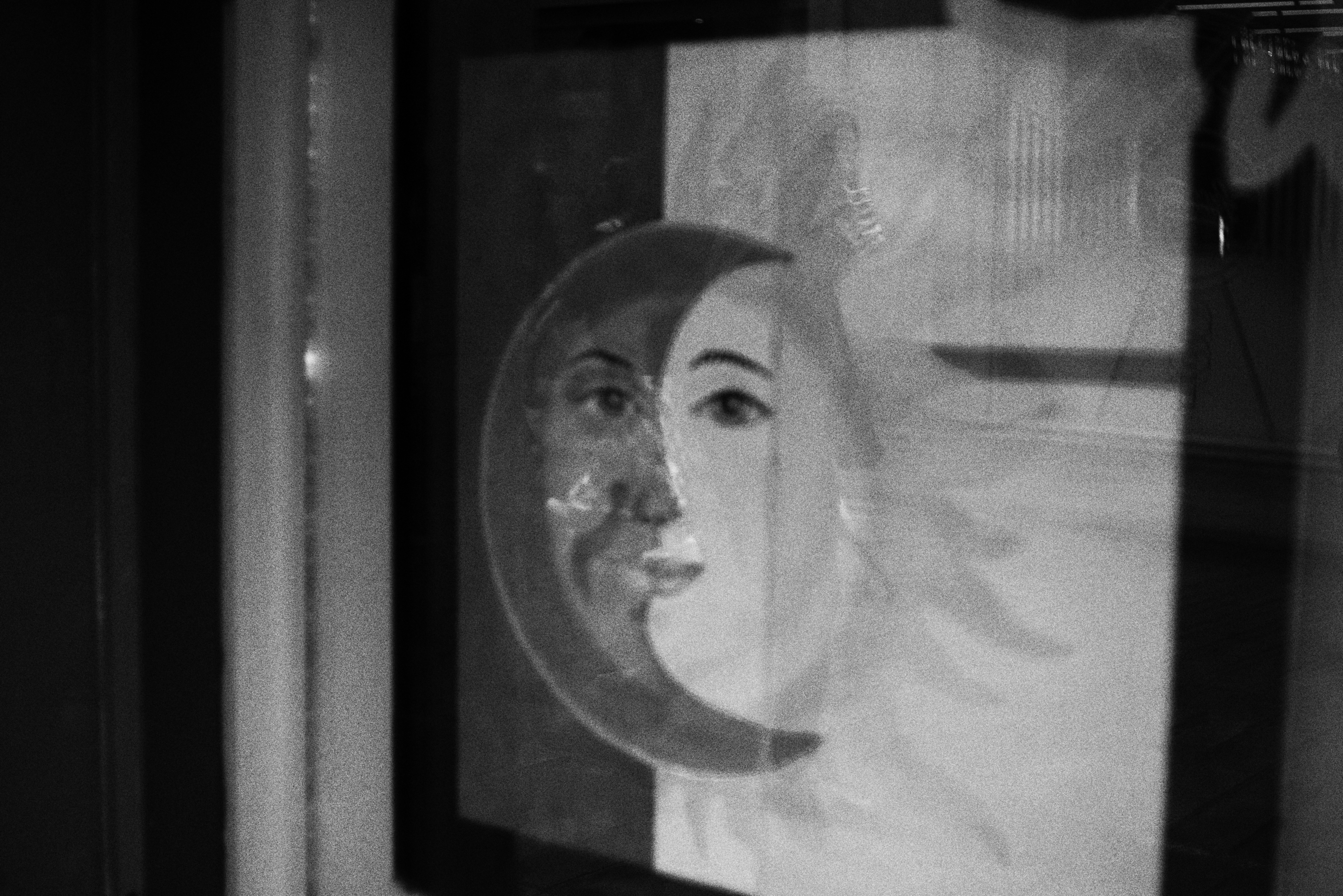 A painting of the sun and moon faces
