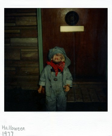 Child in a train conductor costume with a red bandana, dressed up for a free Las Vegas trick-or-treat night