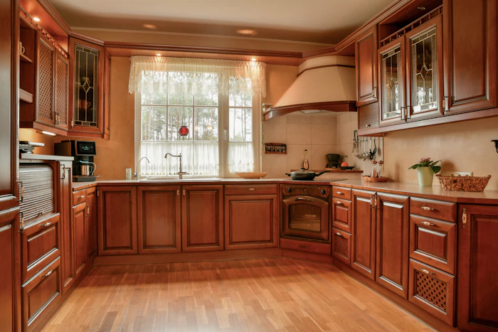 Kitchen with wooden cabinets and wood-look flooring