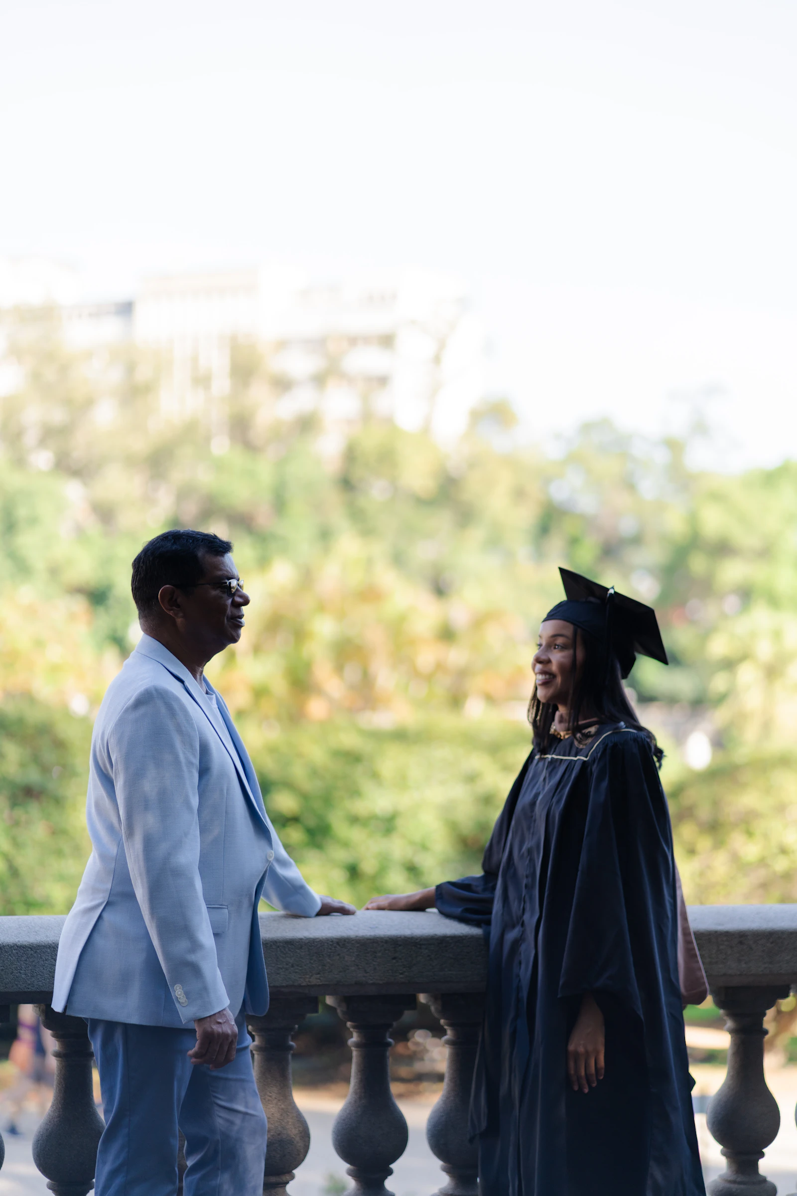 Father and daughter celebrating graduation together