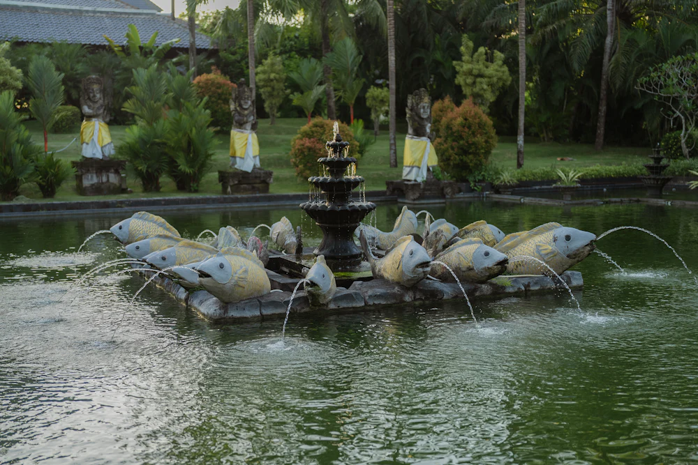 Decorative fountain with lit water jets at dusk