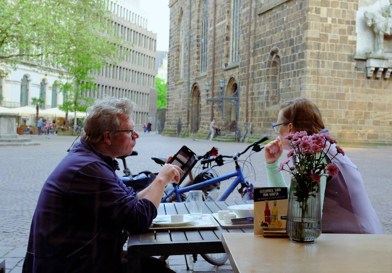 two singles meeting at an outdoor cafe