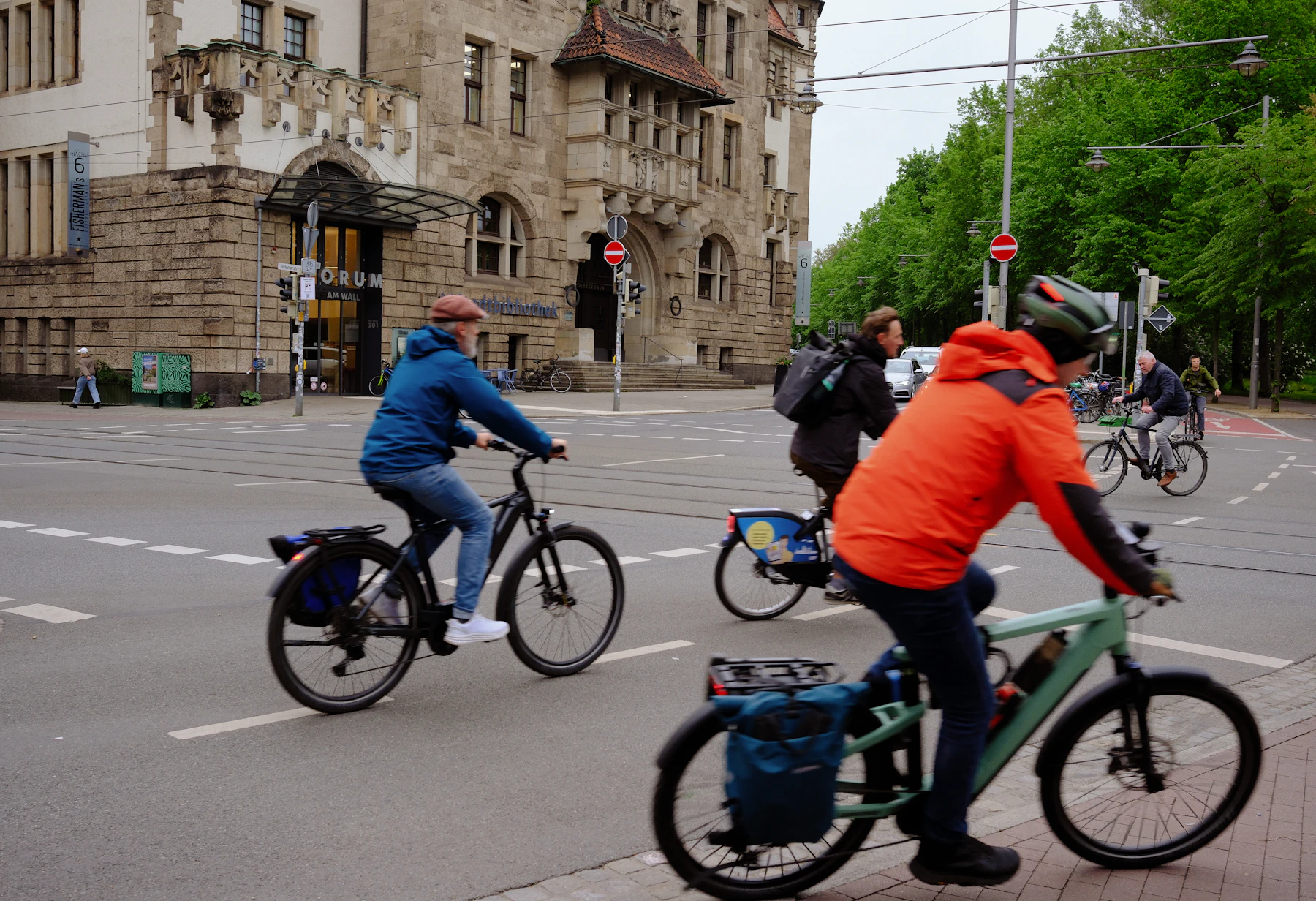 Cyclists moving through an urban street together