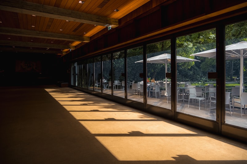 Indoor reception room opening onto an outdoor patio, showing both venue settings