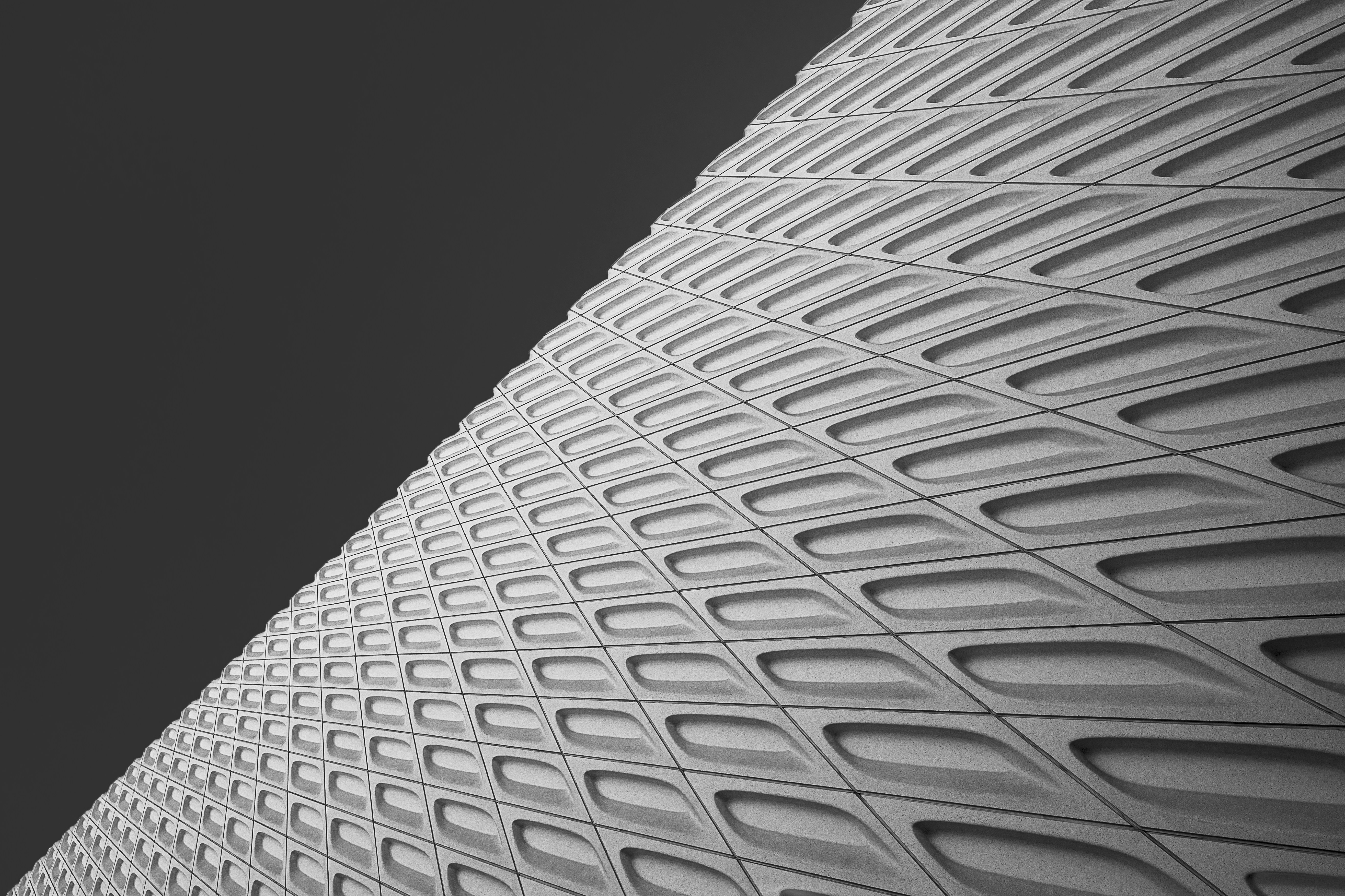 Modern building facade with repeating geometric pattern