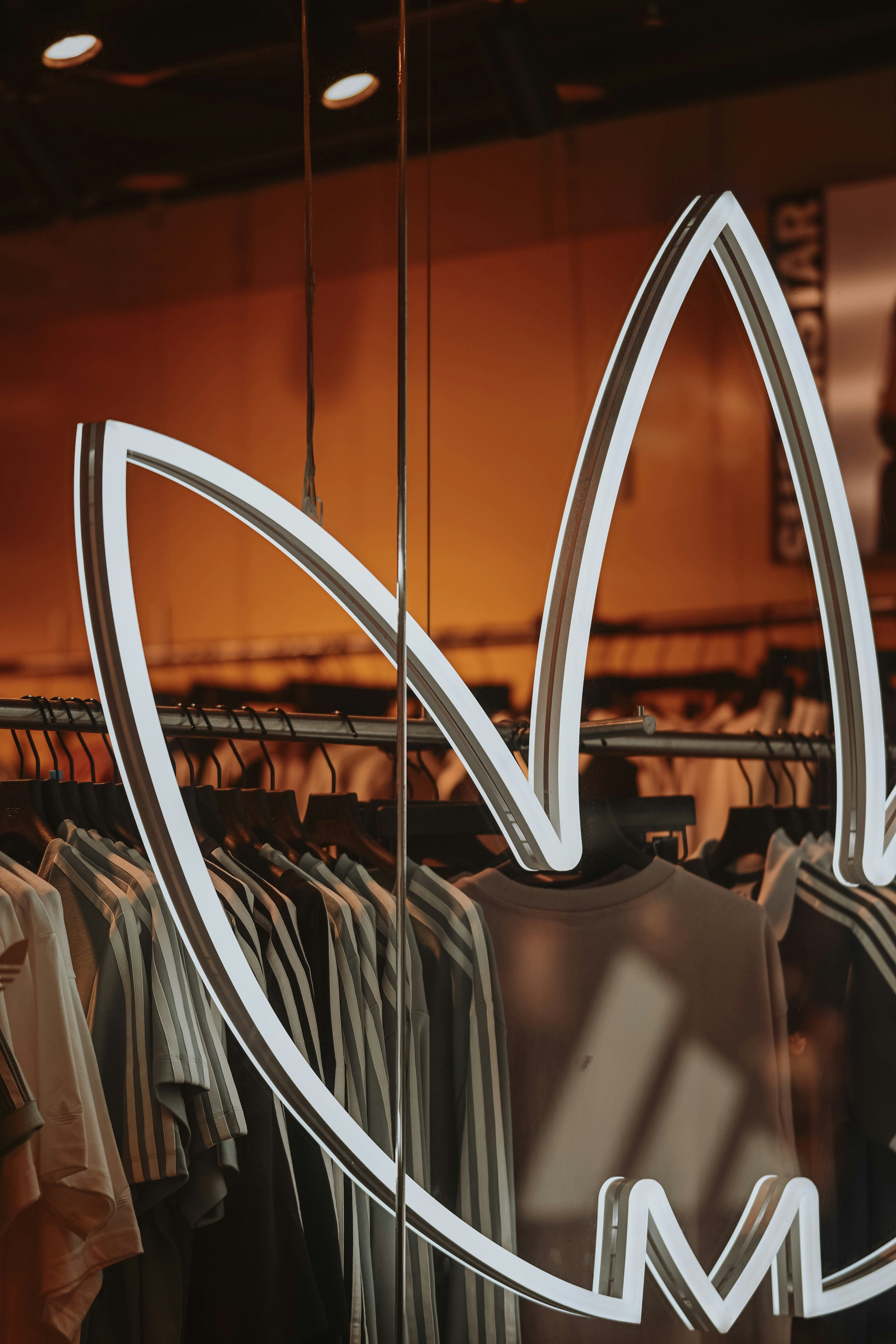 Adidas logo on clothing store window display