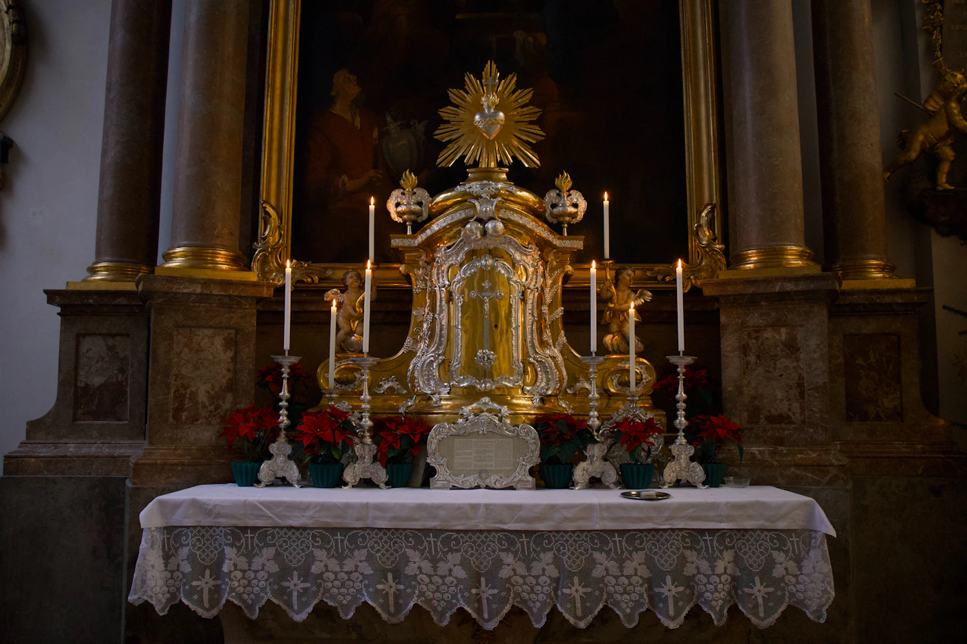 Gilded altar glowing with candles during service